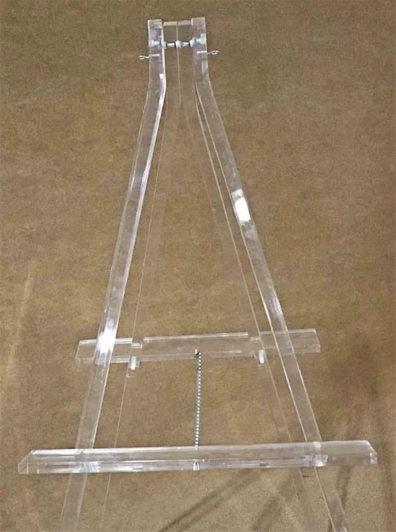 Mid-Century Modern style acrylic easel. Great for home office art display.
Please confirm location.