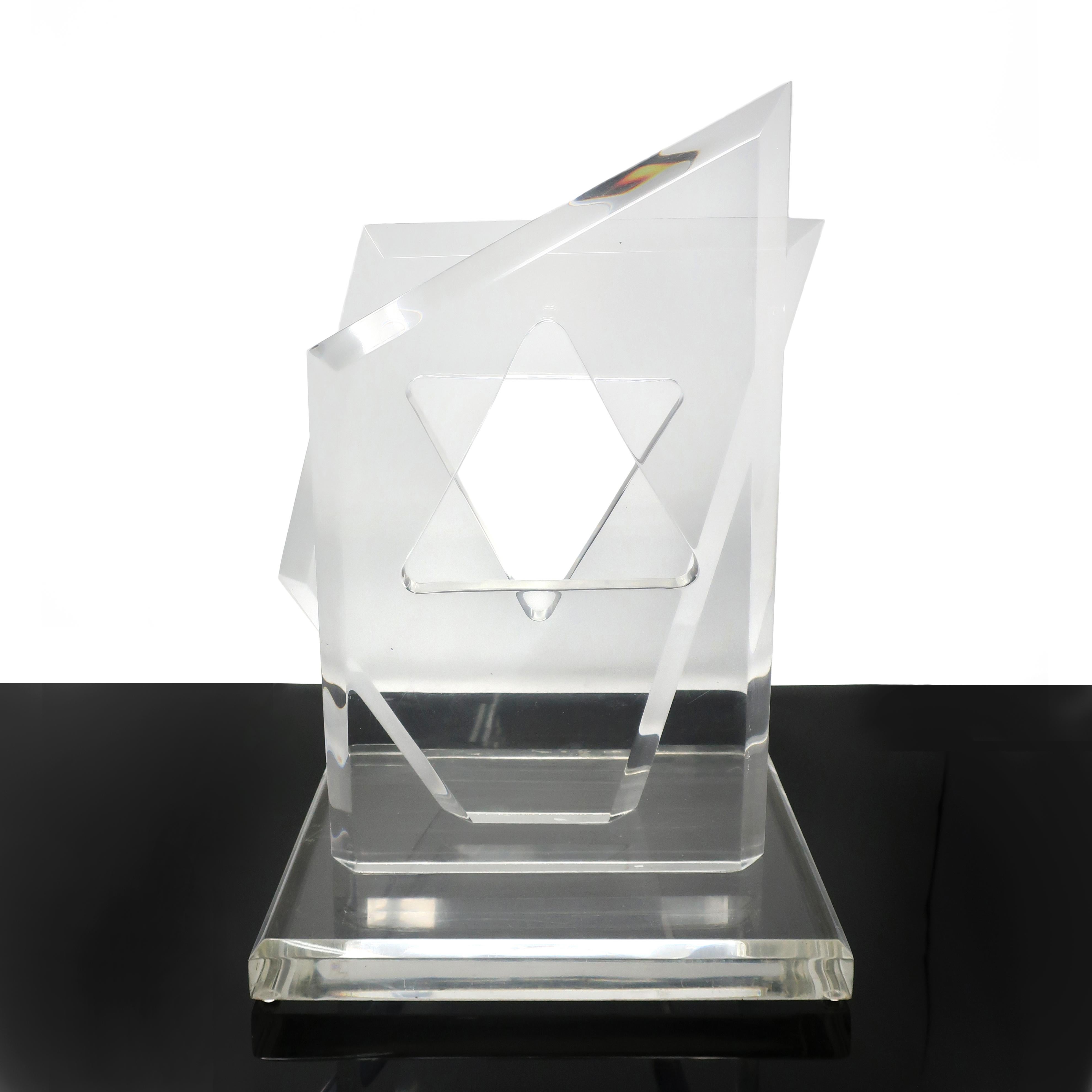 A beautiful piece of modernist sculpture by famed Lucite designer, Hivo Van Teal. Two vertical asymmetrical acrylic pieces mounted on a square base, which when viewed head on reveal a Star of David formed by shapes cut in each angular piece.

In