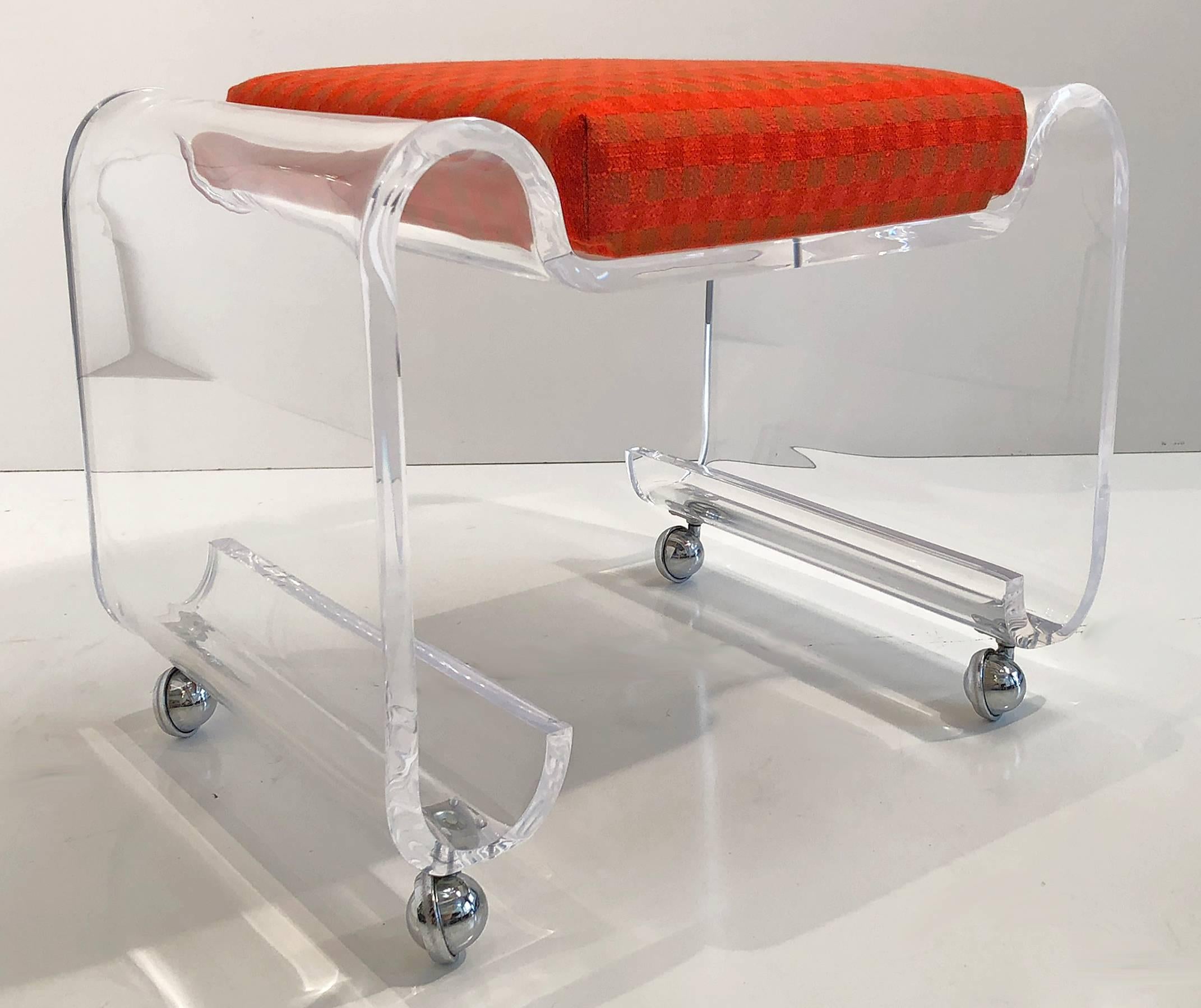 Lucite stool on casters with upholstered seat. Heavy clear Lucite. Top quality materials and design.
