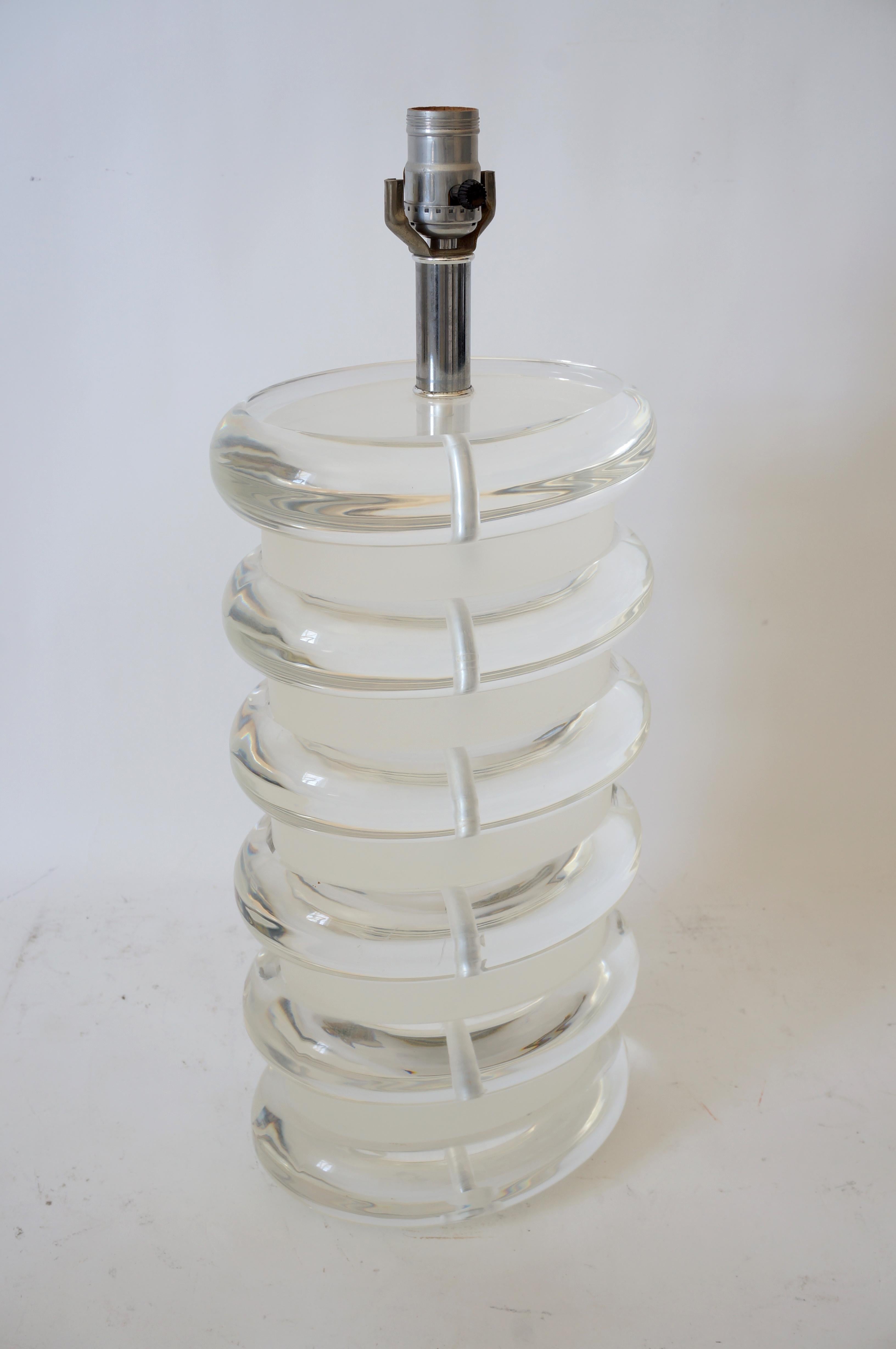 This large scale, chic and stylish Bauer lucite lamp dates to the 1970s-1980s and is fabricated from one solid block of lucite that is finished in a clear and satin finish.