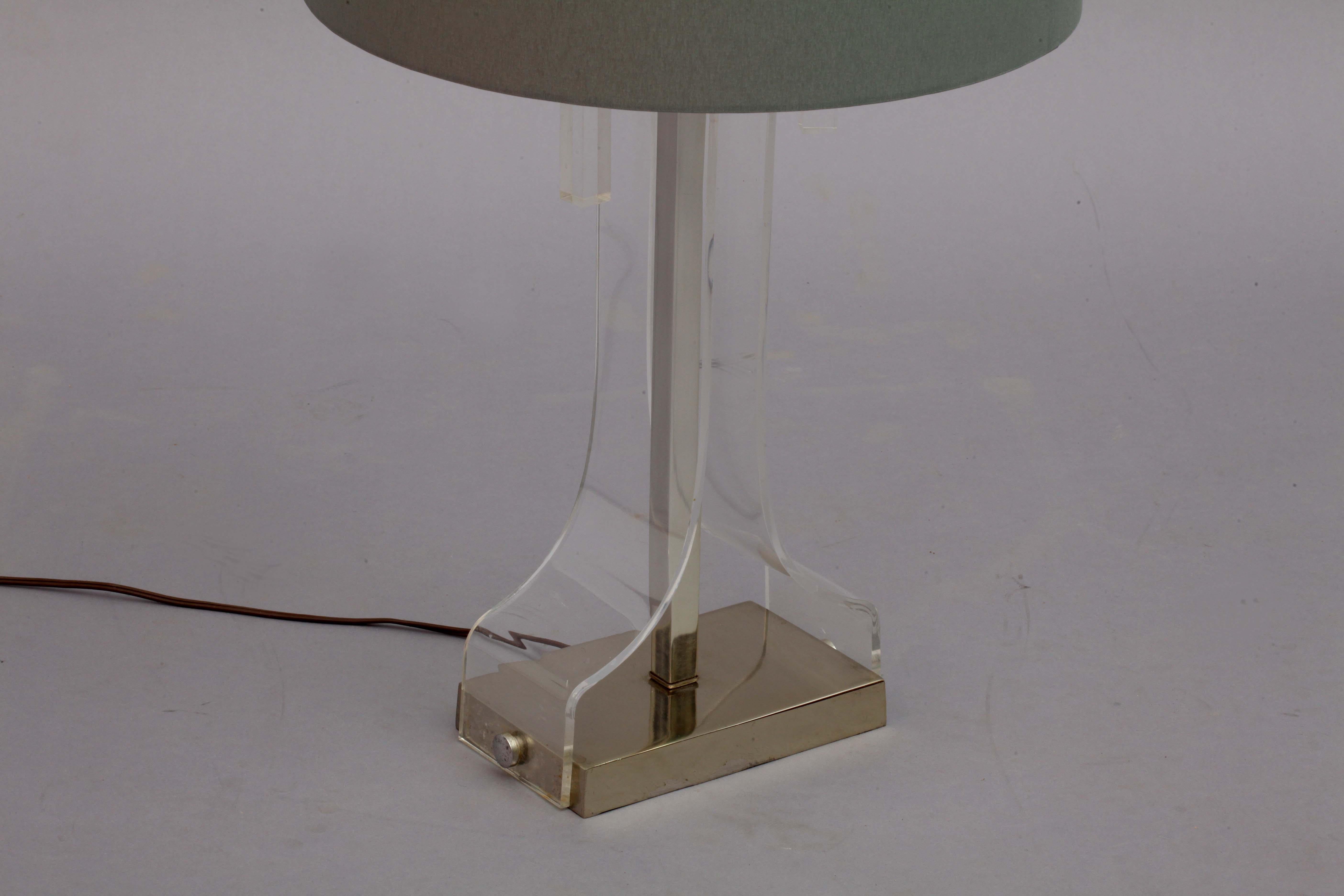 Table lamp,
Italy, 1970
Lucite, chrome, fabric shade.