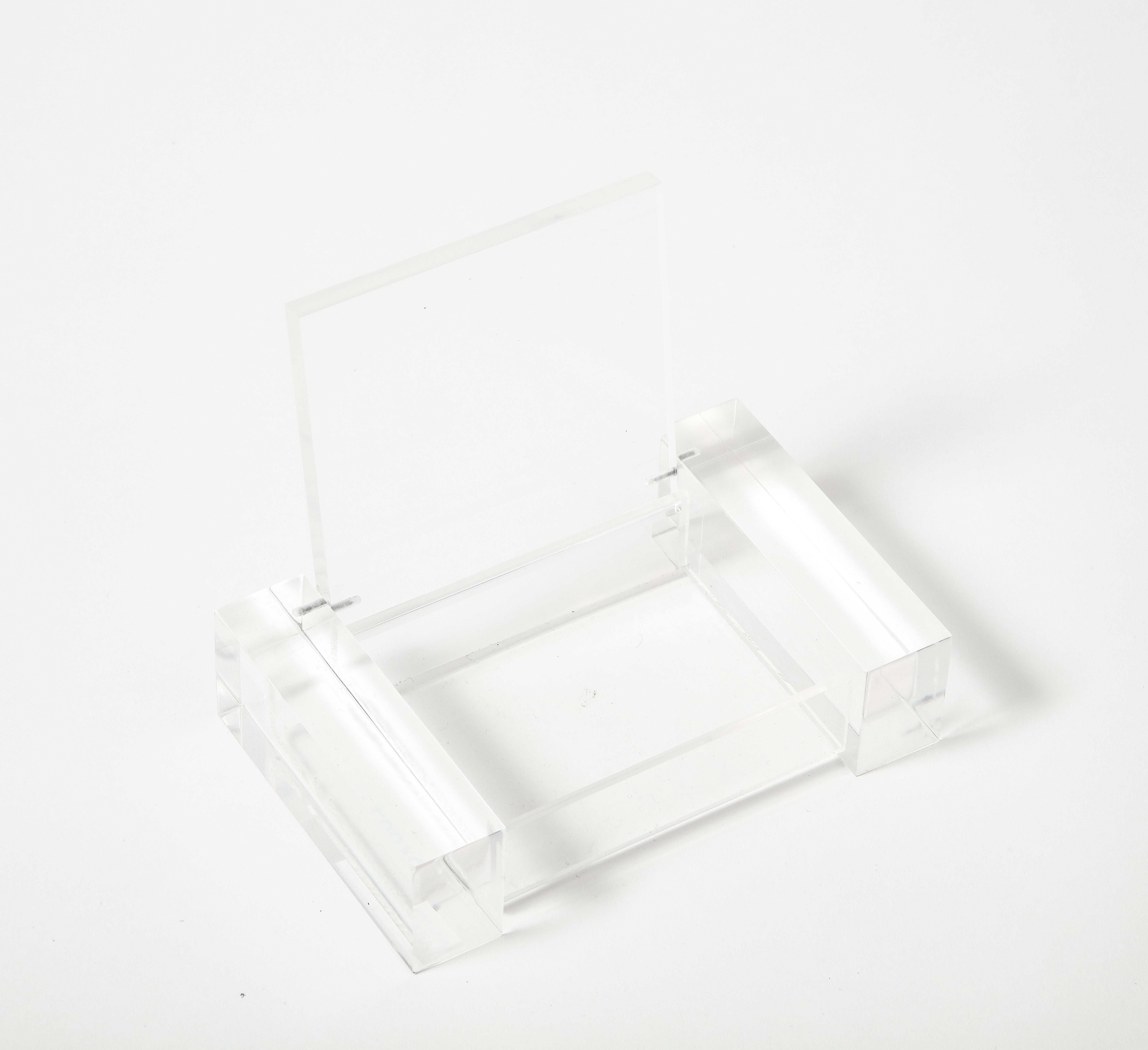Lucite, transparent box.