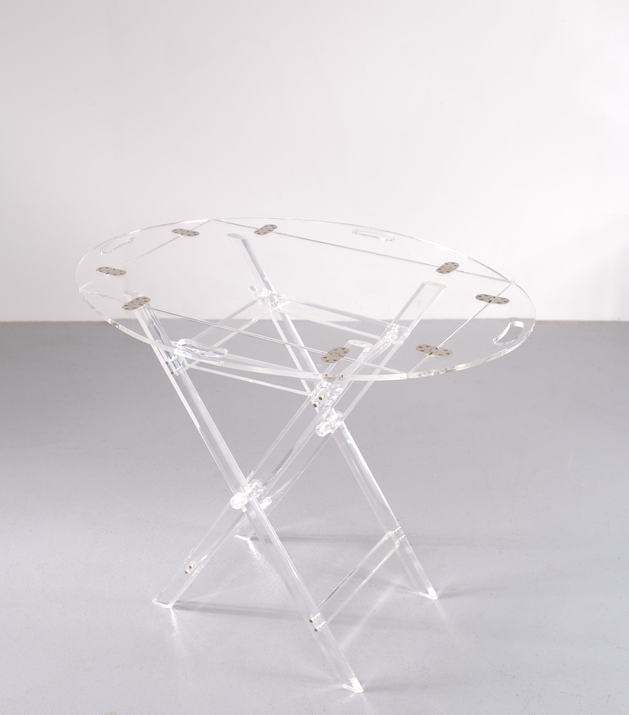 very nice Lucite tray table, cross folding legs, comes with a loose tray with chrome hinges. Beautiful and stylish piece. 1970s France.