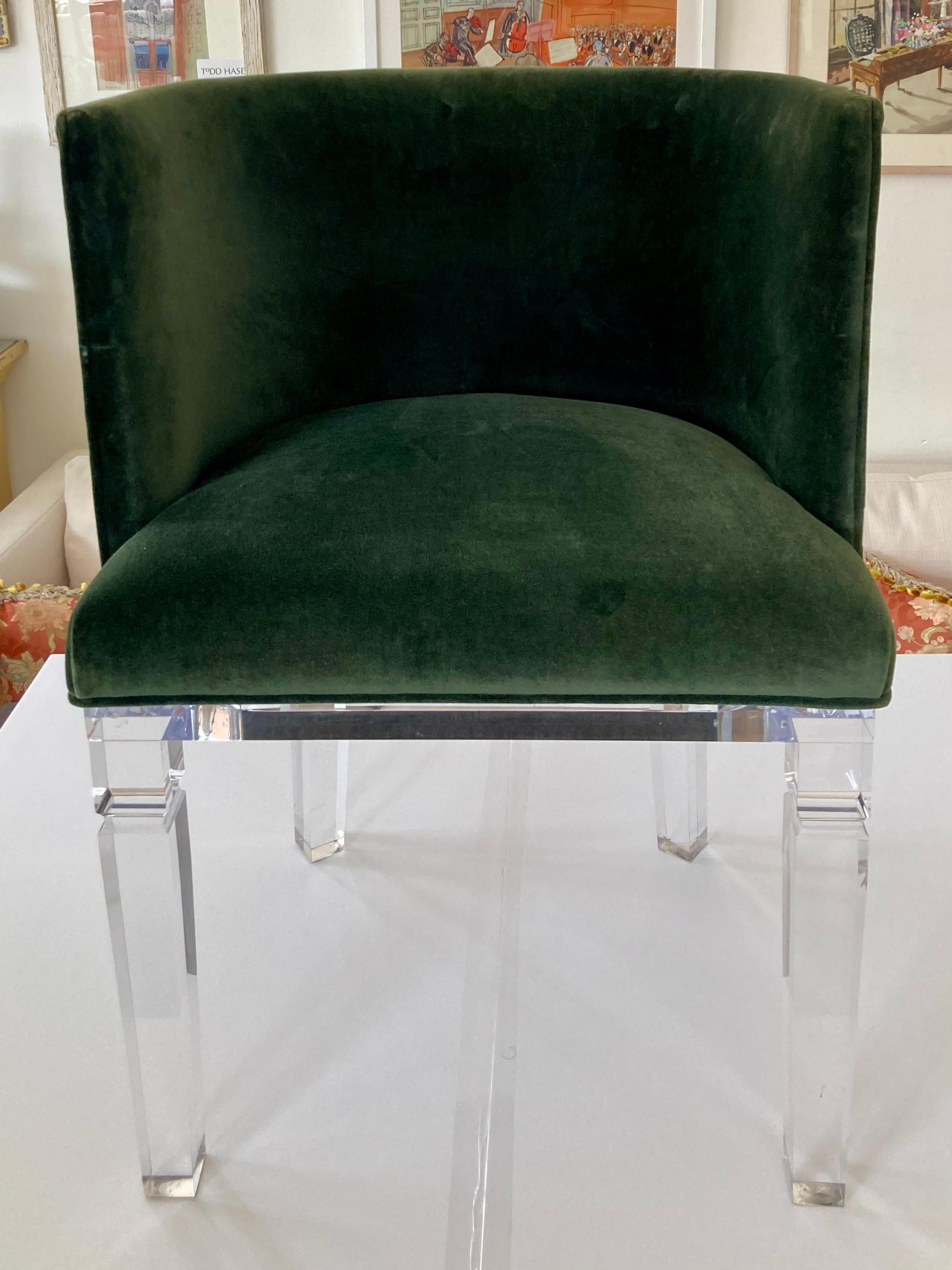Fabulous vintage Lucite upholstered occasional chair. Upholstered in a nice dark green velvet. Interesting design pattern on the thick Lucite base. Heavy thick Lucite material was used to fabricate this chair. Very nice condition for the age.