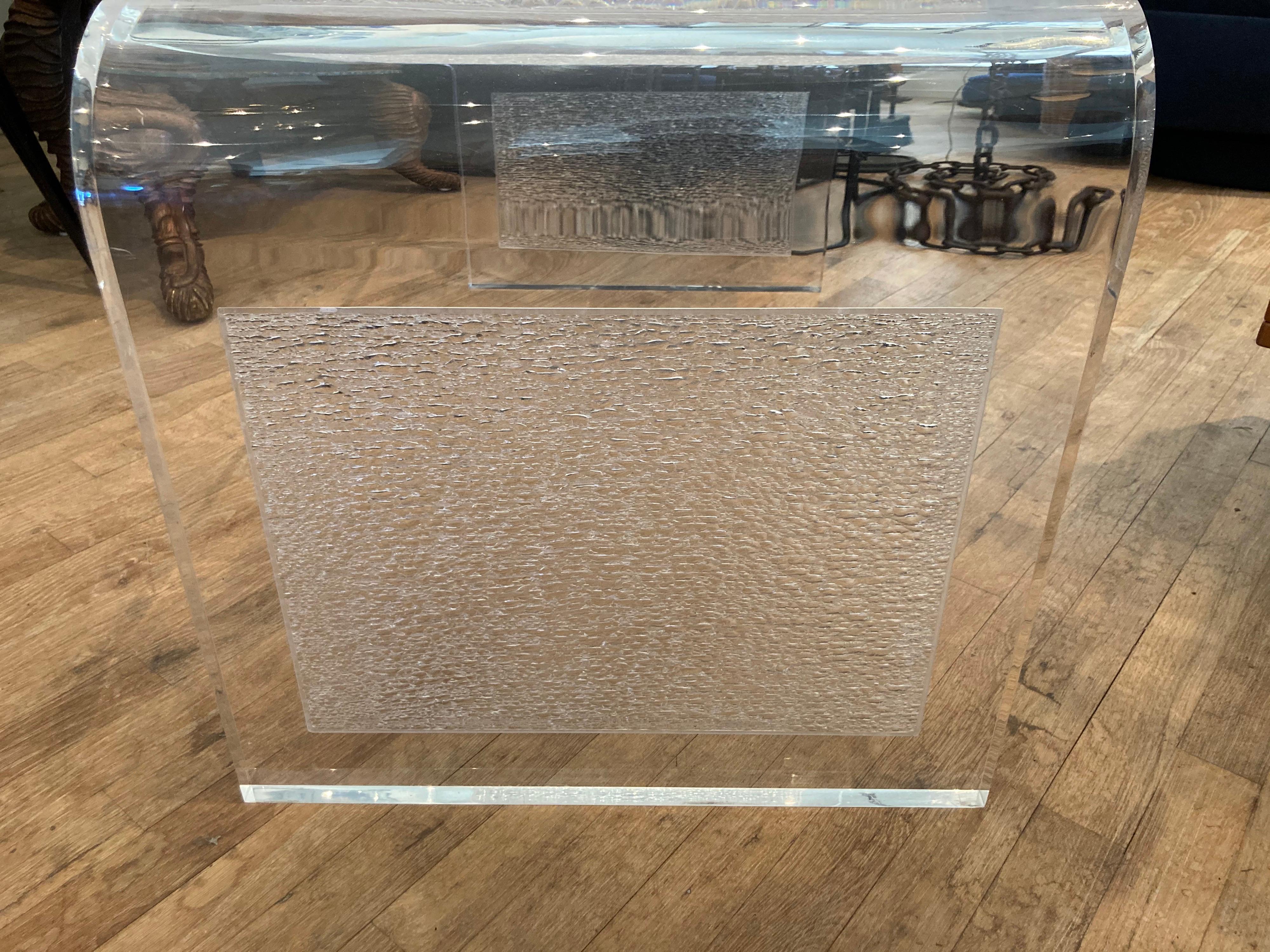 Very substantial lucite waterfall style table with textured interior panels on the sides and underside of the top.... lucite is very thick at 1.25