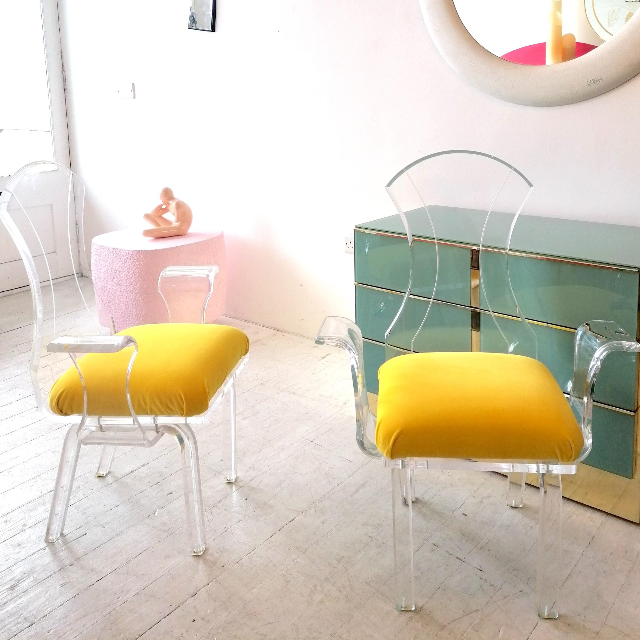 Post-Modern Lucite wing-arm dining or side chairs with yellow velvet seat pads, USA 1980s