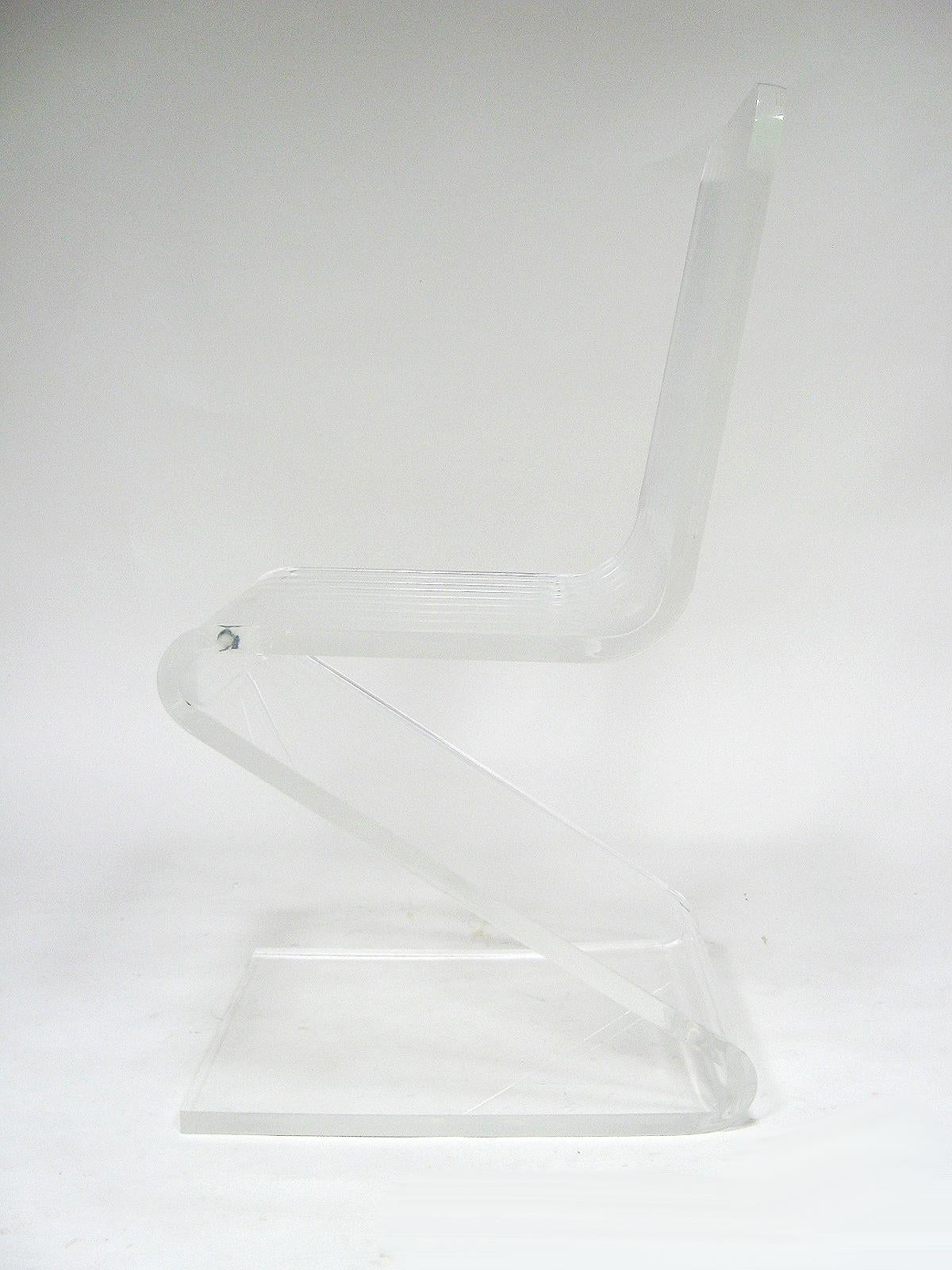 This classic lucite Z chair is a great occasional piece in very good original condition. The transparent quality and minimal form allow it to work in any interior.
