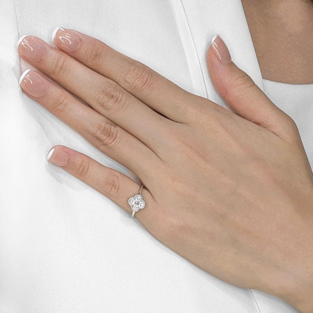 Embrace good fortune and exquisite style with this lucky four-leaf clover ring, meticulously crafted in radiant 18K white gold. Twelve dazzling natural round brilliant diamonds, totaling a brilliant 0.08ct, are artfully set to form the iconic symbol
