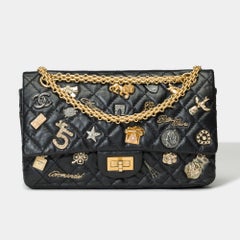 Lucky Charms 2.55 Chanel double flap shoulder bag in black quilted leather, AGHW
