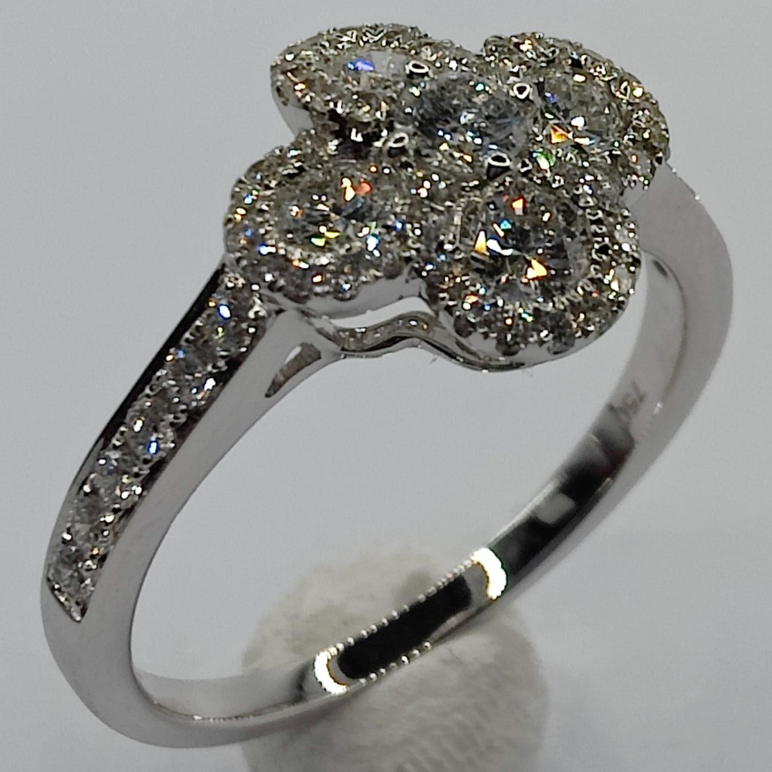 This stunning diamond ring is the perfect choice for adding a touch of luck and whimsy to your look. The ring features a beautiful four-leaf clover design set with diamonds, giving it a sparkling and eye-catching finish. The ring is made of white