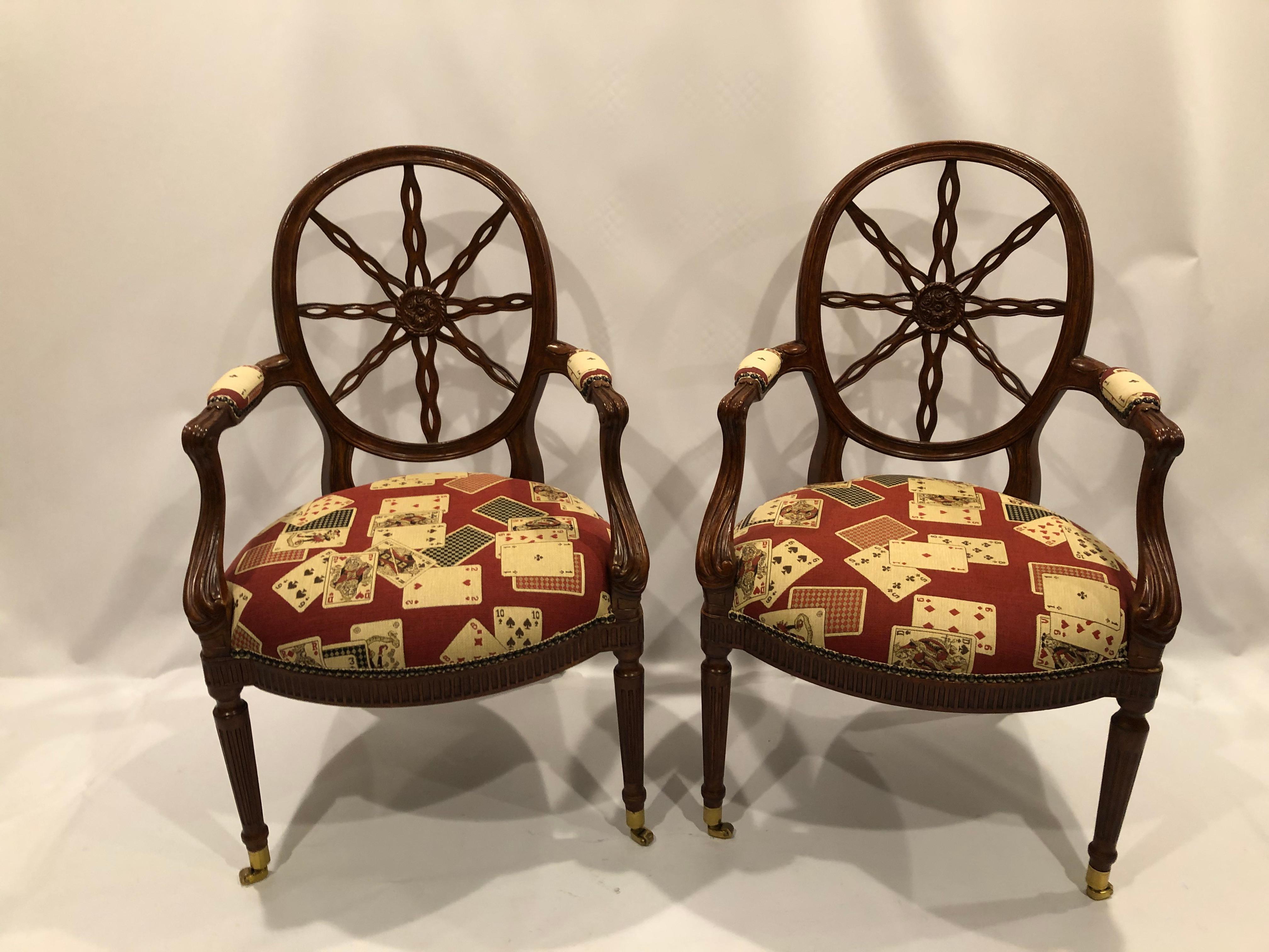 Handsome beautifully made set of 4 carved wood armchairs having marvelous sunburst motife backs and game table appropriate playing cards upholstery.
Great details like brass nailheads and casters and plush upholstered arm rests.
Measures: arm