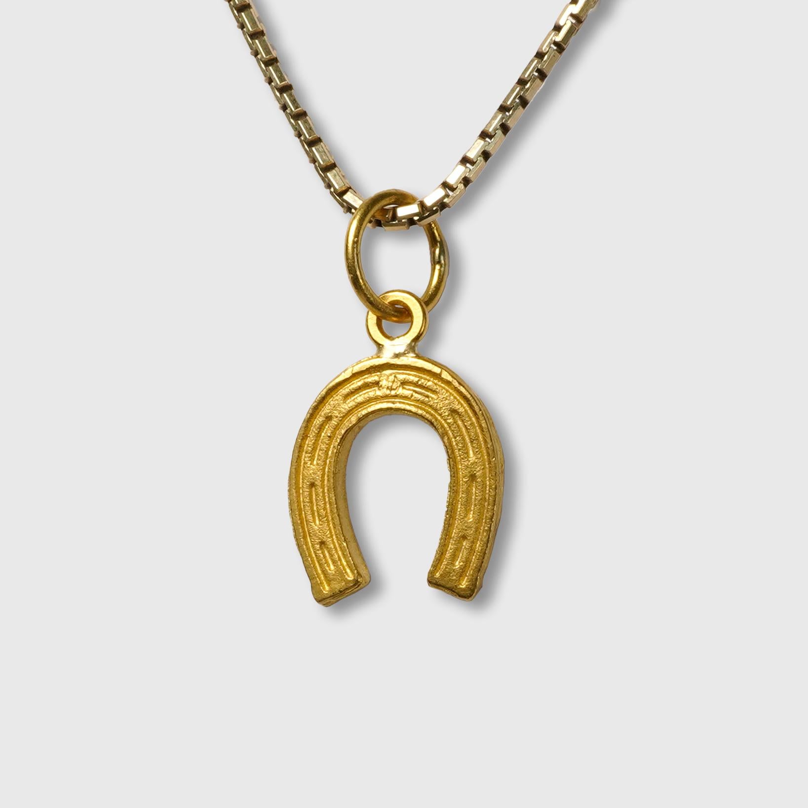 Horse Shoe Charm Pendant, 24K Gold and 0.02ct Diamonds, Tradition, Good Luck, Symbol of protection.

Size - Small Charm (Looks great paired and layered with other charm pendants)
1 Diamond - 0.02cts
24K Solid Gold - 1.68 grams

THE STORY

The