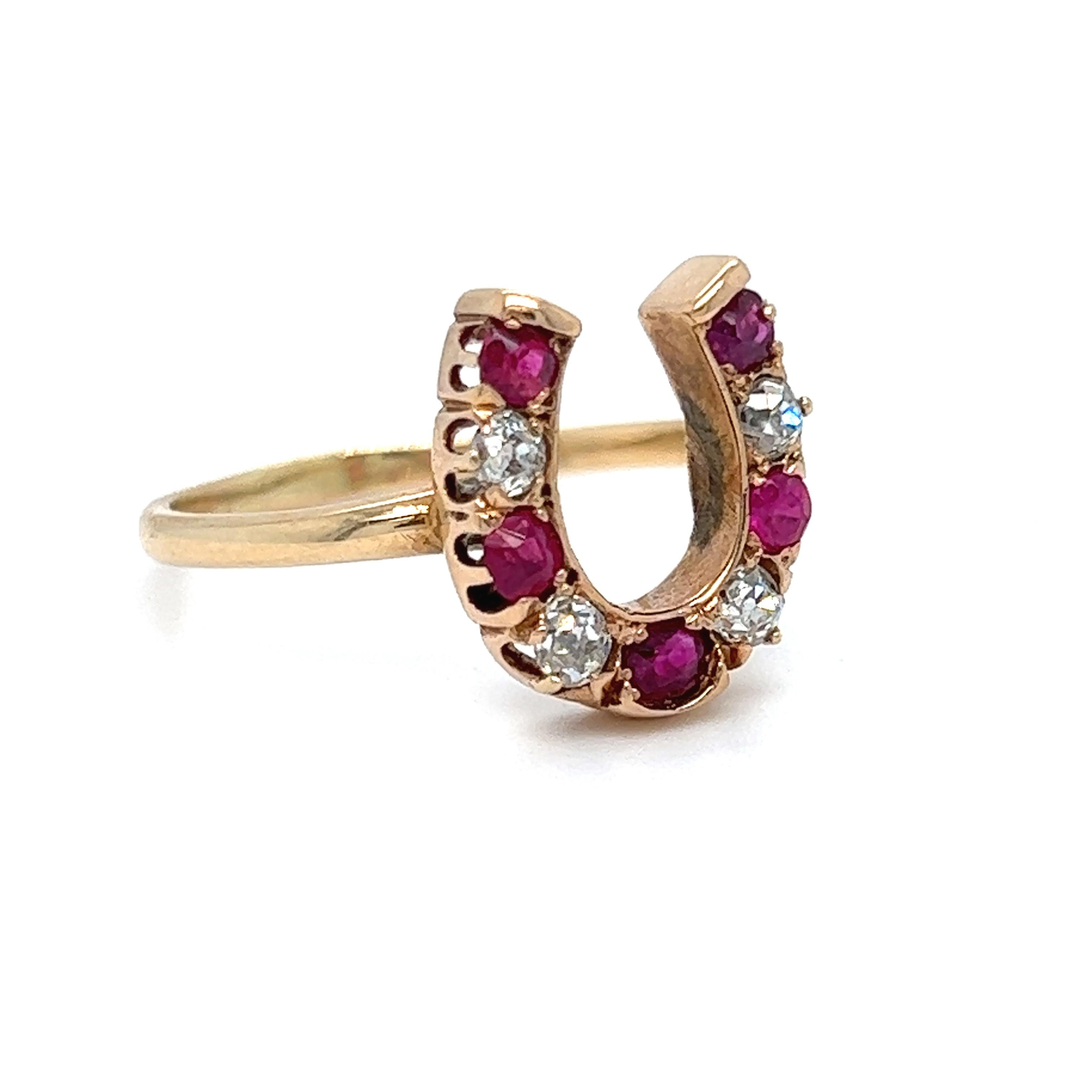 LOVE it! I just know this Vintage Horseshoe Ring is going to bring someone a lot of luck! Crafted in 14K Yellow Gold, and topped in Platinum, the design is a great horseshoe shape, set with alternating natural rubies and diamonds. There are a total