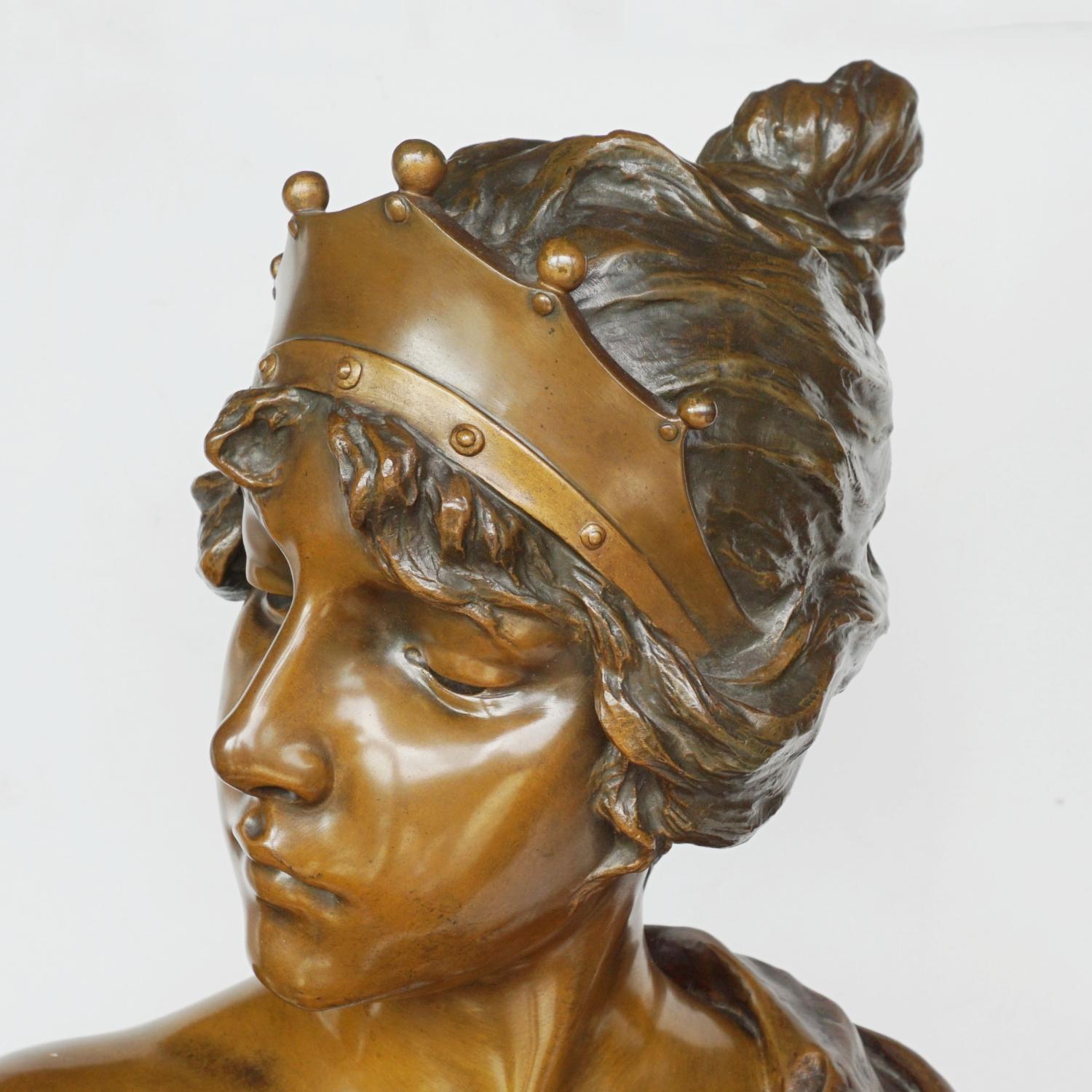 'Lucréce' a large Art Nouveau bronze bust by Emmanuel Villanis (1858-1914). Modelled as a young Lucréce with unkept hair, wearing a diadem with a loose fitted shawl draped around her shoulders. Fine original light and dark brown patination. Signed
