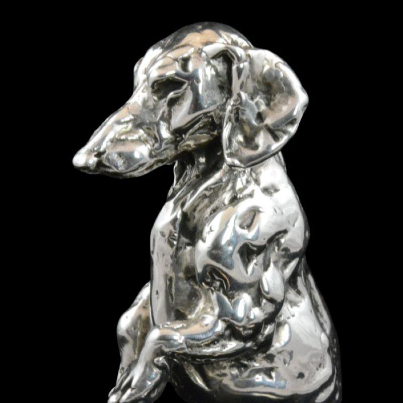 A 'Seated Dachshund’ sterling silver sculpture by Lucy Kinsella 1