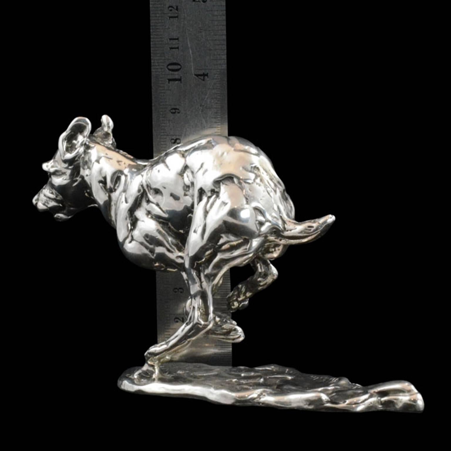 Lucy Kinsella exclusive to Hancocks
Length 17cm x height 9cm
395 grams

A 'Bunched Terrier' sterling silver sculpture by Lucy Kinsella, the limited edition finely modelled terrier races across the ground, his muscles tense and body bunched, mid