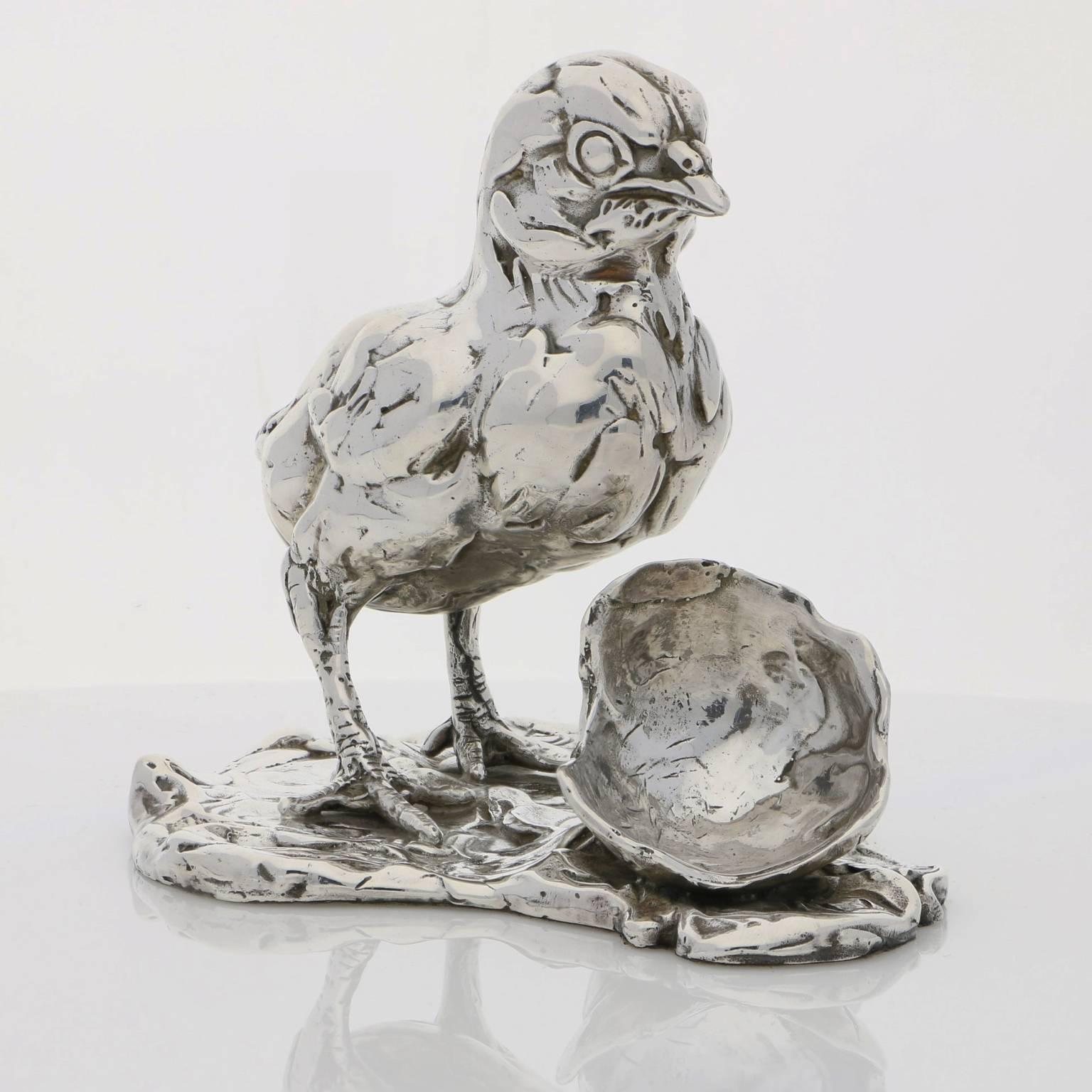 The limited edition finely modelled newly hatched chick stands uncertainly, legs and feet wide, between the pieces of his broken shell.  His eyes are only half open as he blinks and takes in his world for the first time.  He has been sculpted in