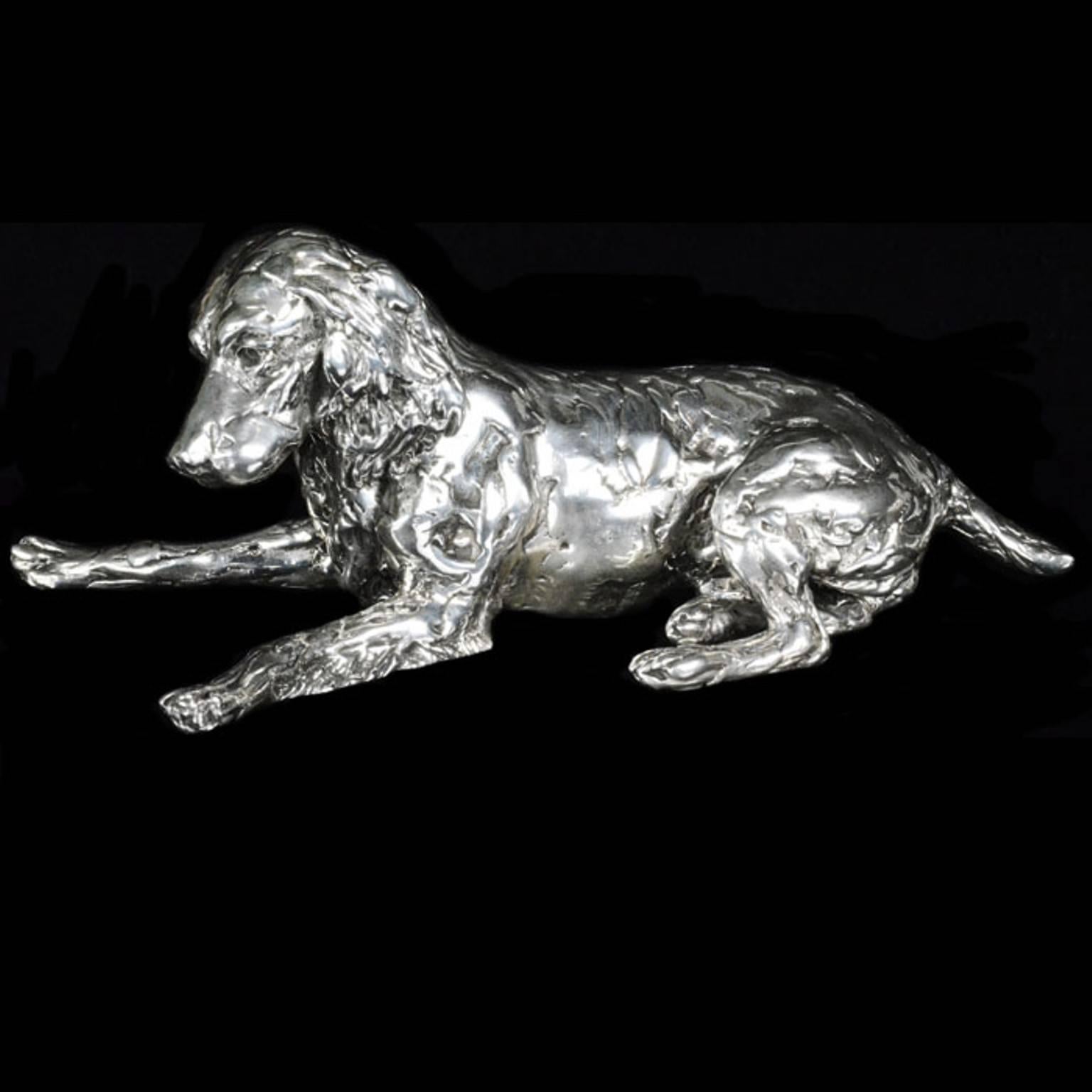 A 'Spaniel and Pup' sterling silver sculpture by Lucy Kinsella, the limited edition finely modelled spaniel lying down and watching indulgently as her puppy rolls around playfully in front of her.  The puppy lies on its back, huge ears spread out on