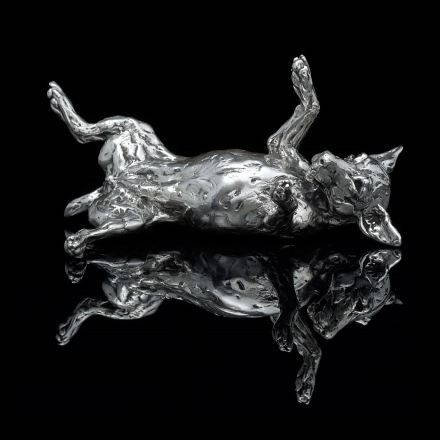 A 'Rolling Terrier' sterling silver sculpture by Lucy Kinsella, the limited edition finely modelled terrier rolling on his back, all four legs in the air and playful expression on his face.  He has been sculpted in Kinsella’s instantly recognisable
