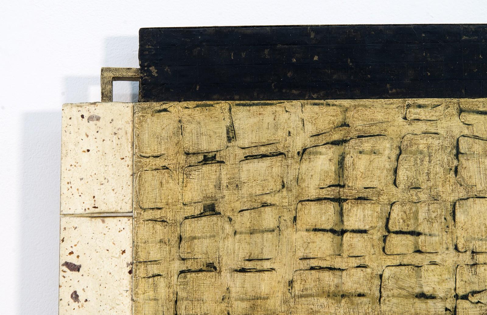 Textured wood sections in light brown, gold and black intersect in this wall relief.

Lucy Maki has been a professional painter for over 25 years. She was born in Ames, Iowa in 1955 and received her MA and MFA from the University of New Mexico,