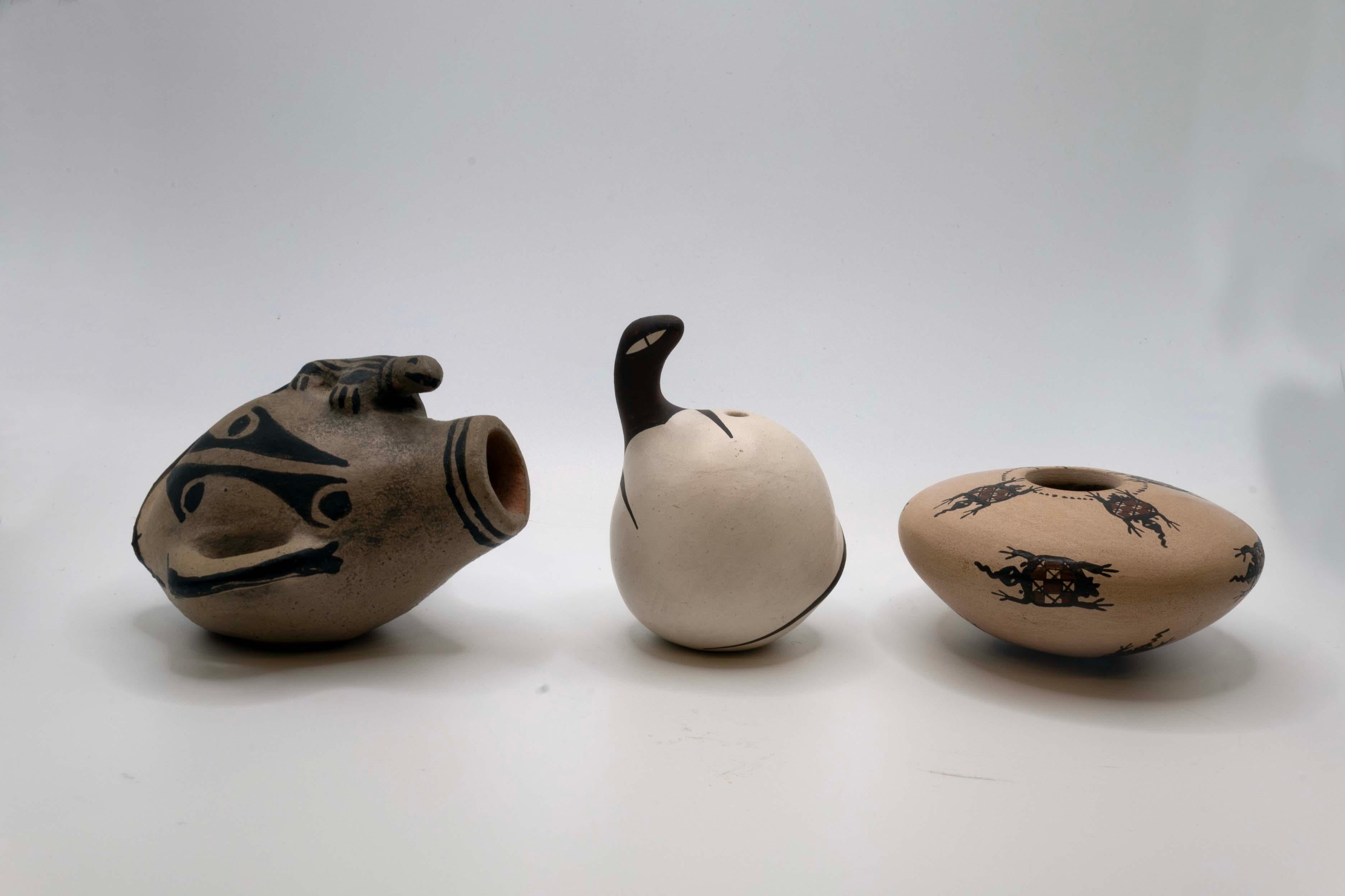 An eclectic set of Native Southwest pottery vessels from New Mexico. Each vessel is signed by a different artist – Lucy R Suina (Cochiti), A.A. Peynetsa Zuni (Avelia & Anderson Peynetsa, Zuni Pueblo Potters) and Carmen Veloz (Mata Ortiz). The