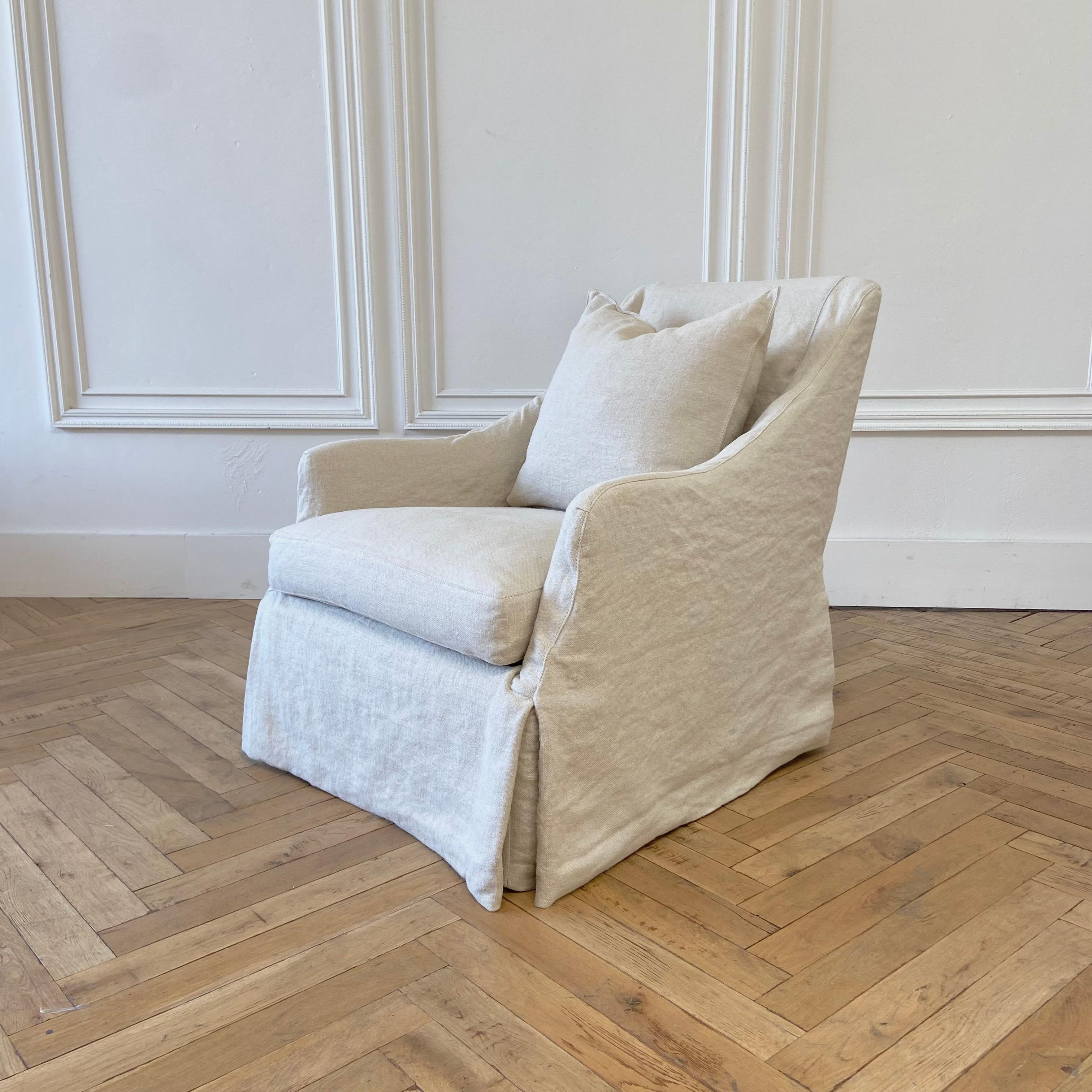 Custom linen slip covered swivel chair. Slip cover made out of 100% natural Belgian Linen. Seat is down wrapped foam. 
Measures: 31” W x 38” D x 34” H
Seat height: 18”. 
Seat depth: 20”. 
Arm height: 22”.