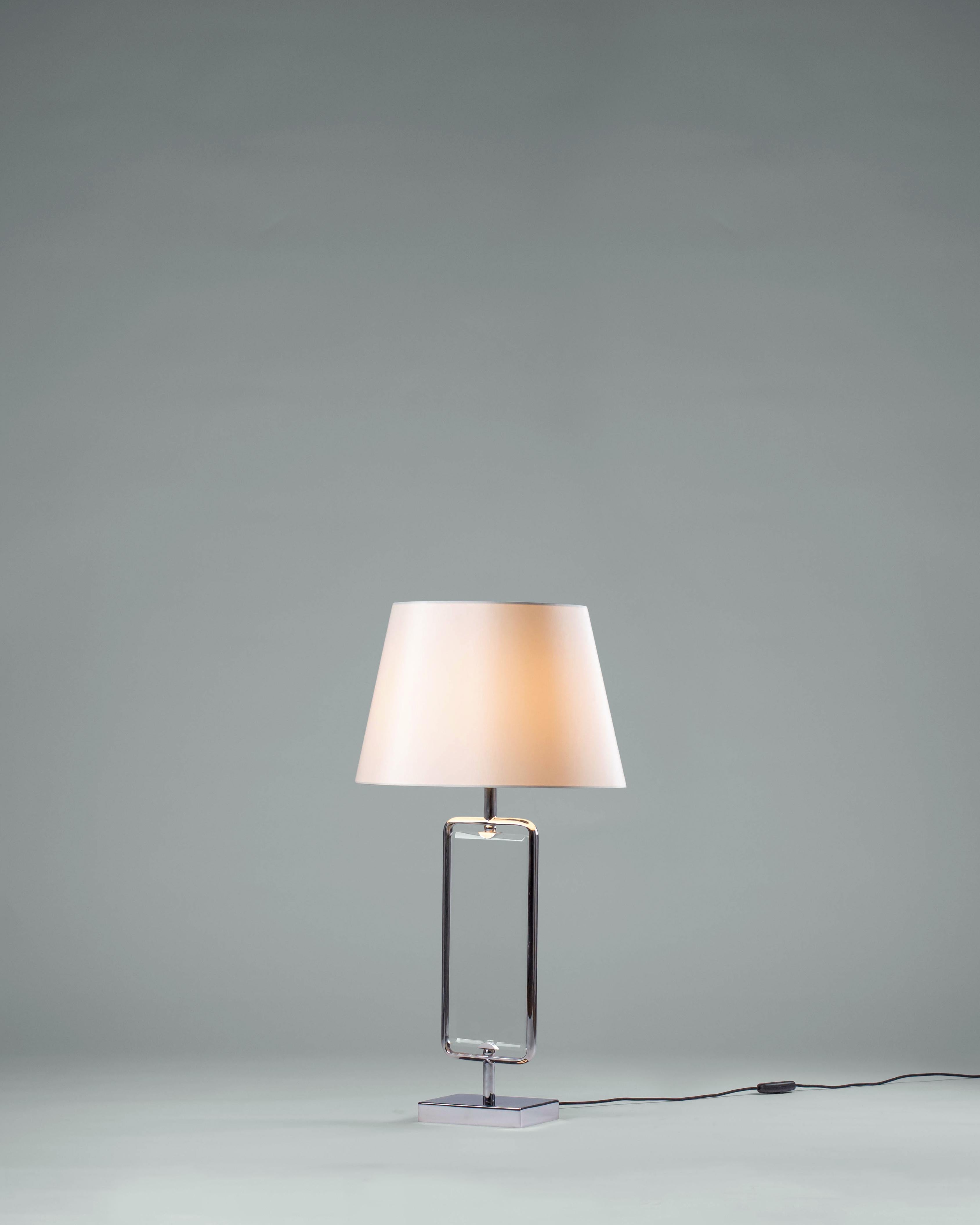 Lucy Table Lamp by G.Luce
Dimensions: D 41 x H 75 cm
Materials: Polished Chrome Structure, a Bevelled Crystal Heart.
Weight: 5 Kg. 

G.Luce is the result of a thirty-year history of commitment, research and collaboration with a network of expert
