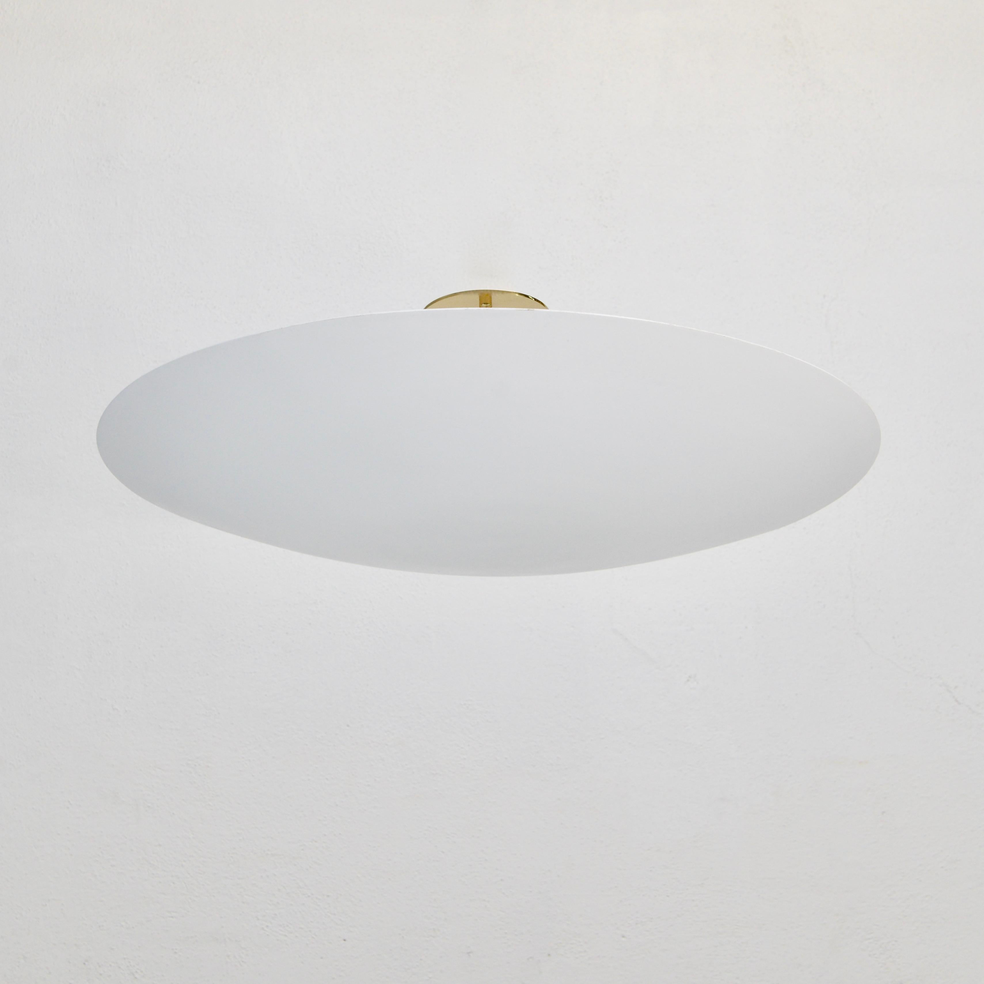 Part of our Lumfardo Luminaires Contemporary Collection, the LUdish FWB Flush Mount is an elegant flat white hand painted aluminum and brass modern bowl flush mount light fixture. Made to order. The flush mount comes with 3-E26 medium based sockets,