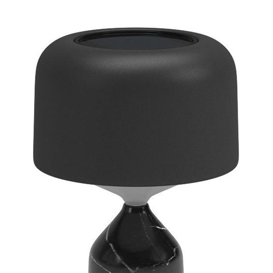 Table lamp ludo black outdoor with solid polished black stone base
with outdoor leather base plate. With shade in polyethylene and aluminium.
With leather anti-scratch disc on base inn atural color. With 2 mains power 
and solar rechargable LED