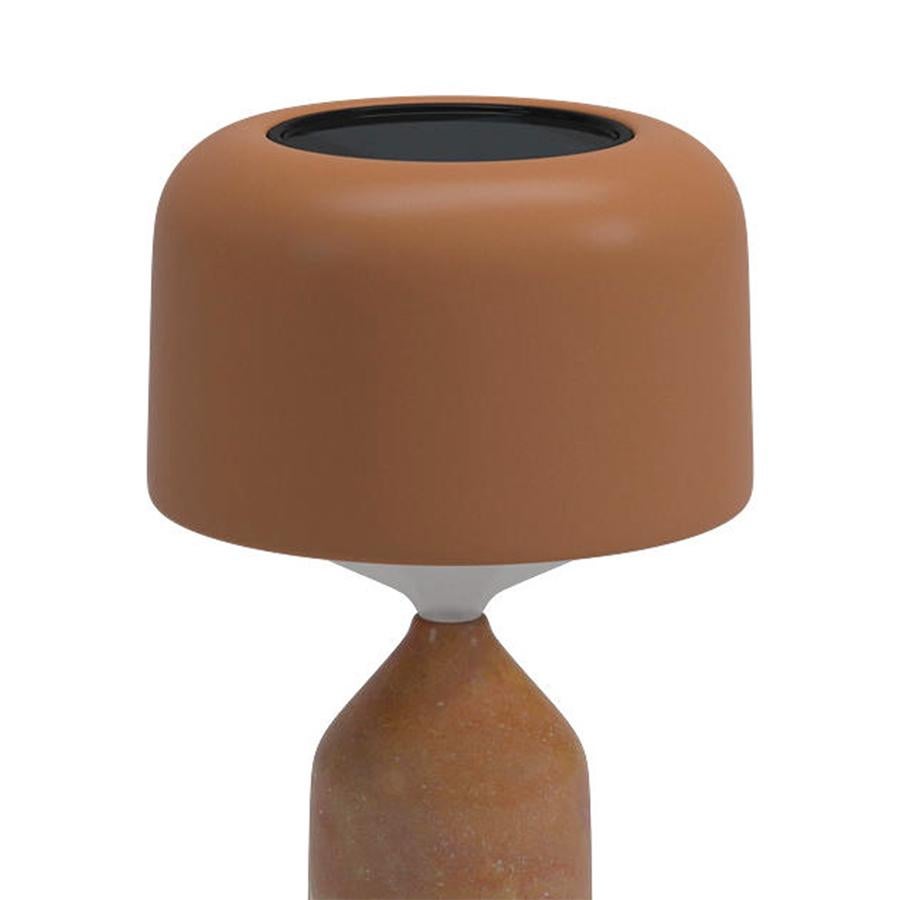 Table lamp Ludo Fox outdoor with solid polished fox color stone base
with outdoor leather base plate. With shade in polyethylene and aluminium.
With leather anti-scratch disc on base in natural color. With 2 mains power 
and solar rechargable LED