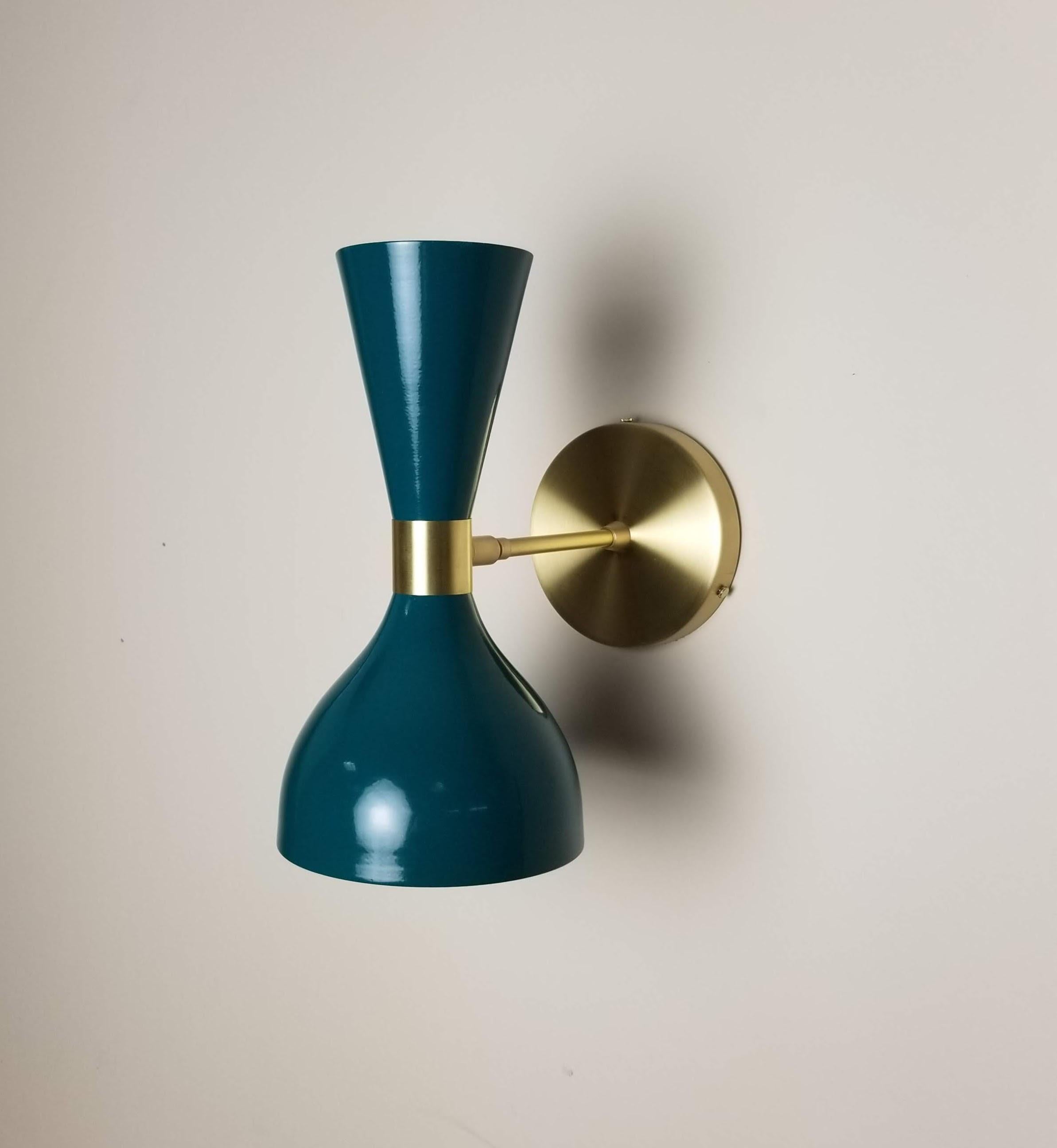 Our best-selling LUDO wall sconce or reading light shown in natural brass and our popular 