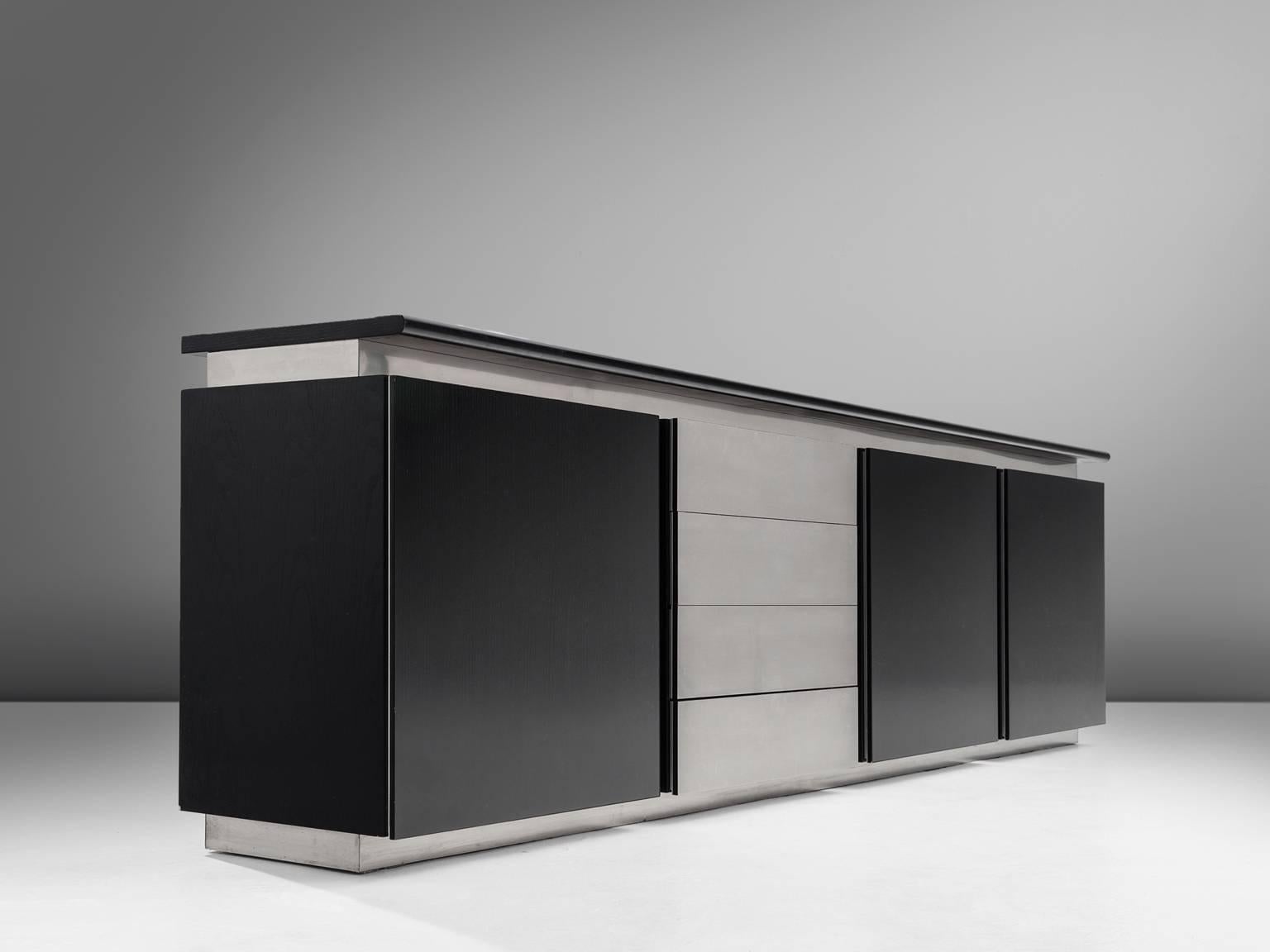 Ludovico Acerbis for Acerbis, sideboard, black lacquered wood and steel, 1970s, Italy.

Sleek and modern credenza in stainless steel and stained oak is designed by Ludocivo Acerbis (1939). This cabinet has both a contemporary yet monumental