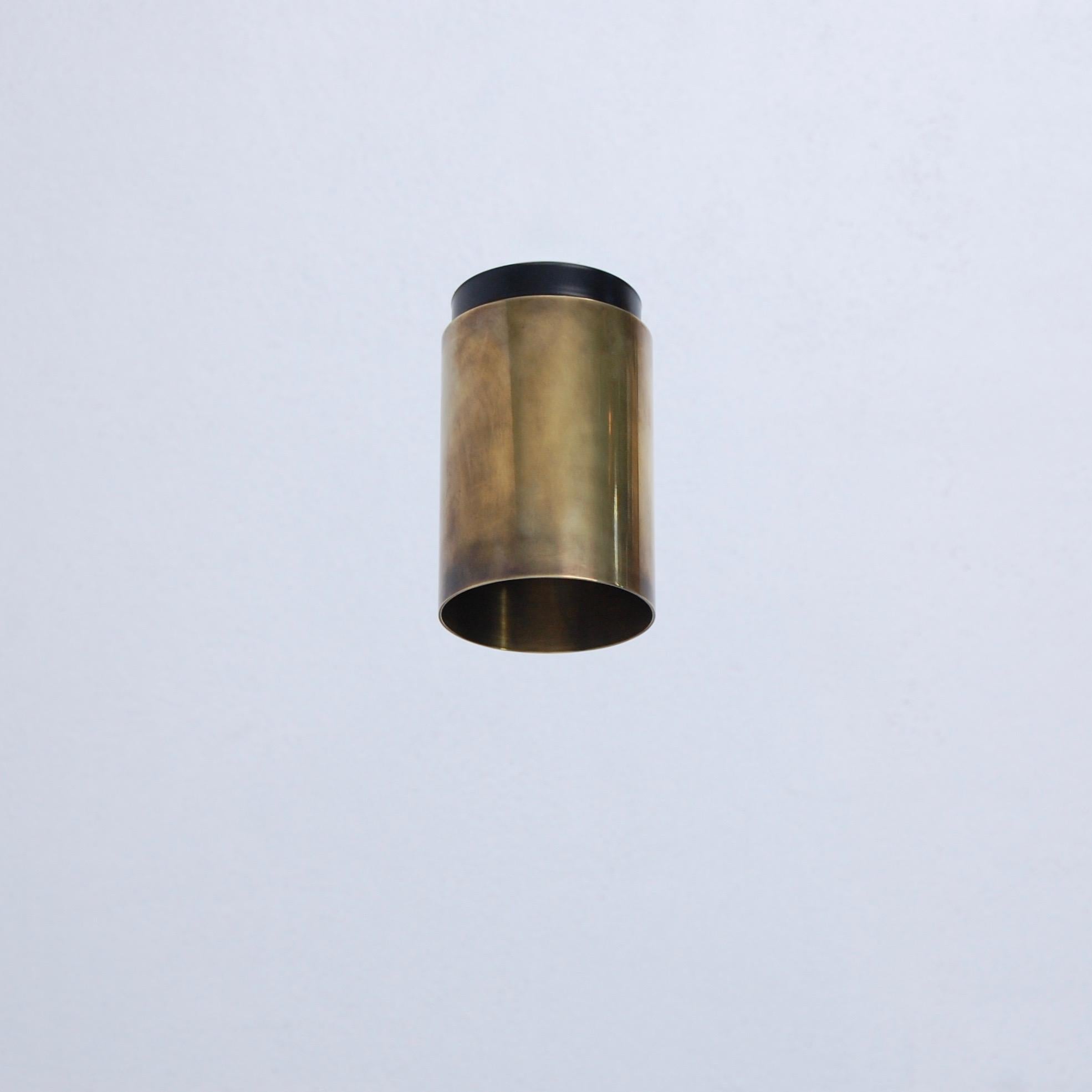 The LUdown cylinder flush mount fixture by Lumfardo Luminaires is part of our contemporary collection. In patinated unlacquerd brass and steel with (1) E26 medium based socket. Light bulb included with order.
Measurements:
Fixture height: