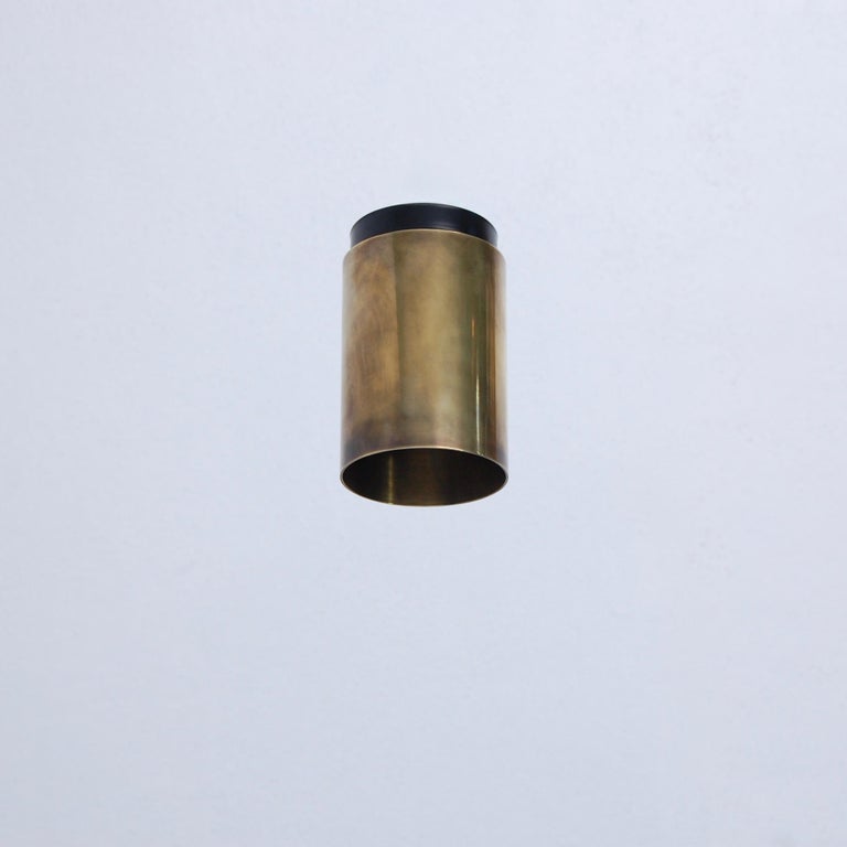 The LUdown cylinder flush mount fixture by Lumfardo Luminaires is part of our contemporary collection. In patinated unlacquerd brass and steel with (1) E26 medium based socket. Light bulb included with order.
Measurements:
Fixture height: