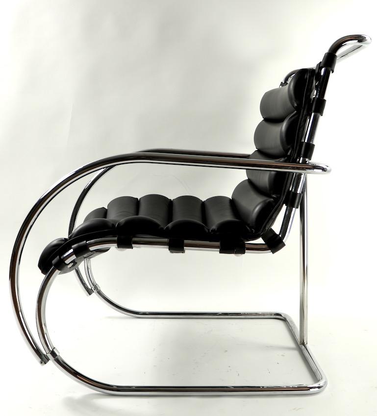 Classic tubular chrome and black leather armchair, in very fine, original condition. Design after the iconic Mies MR lounge, this example features a continuous sling seat and backrest of segmented leather elements. We believe the chair was