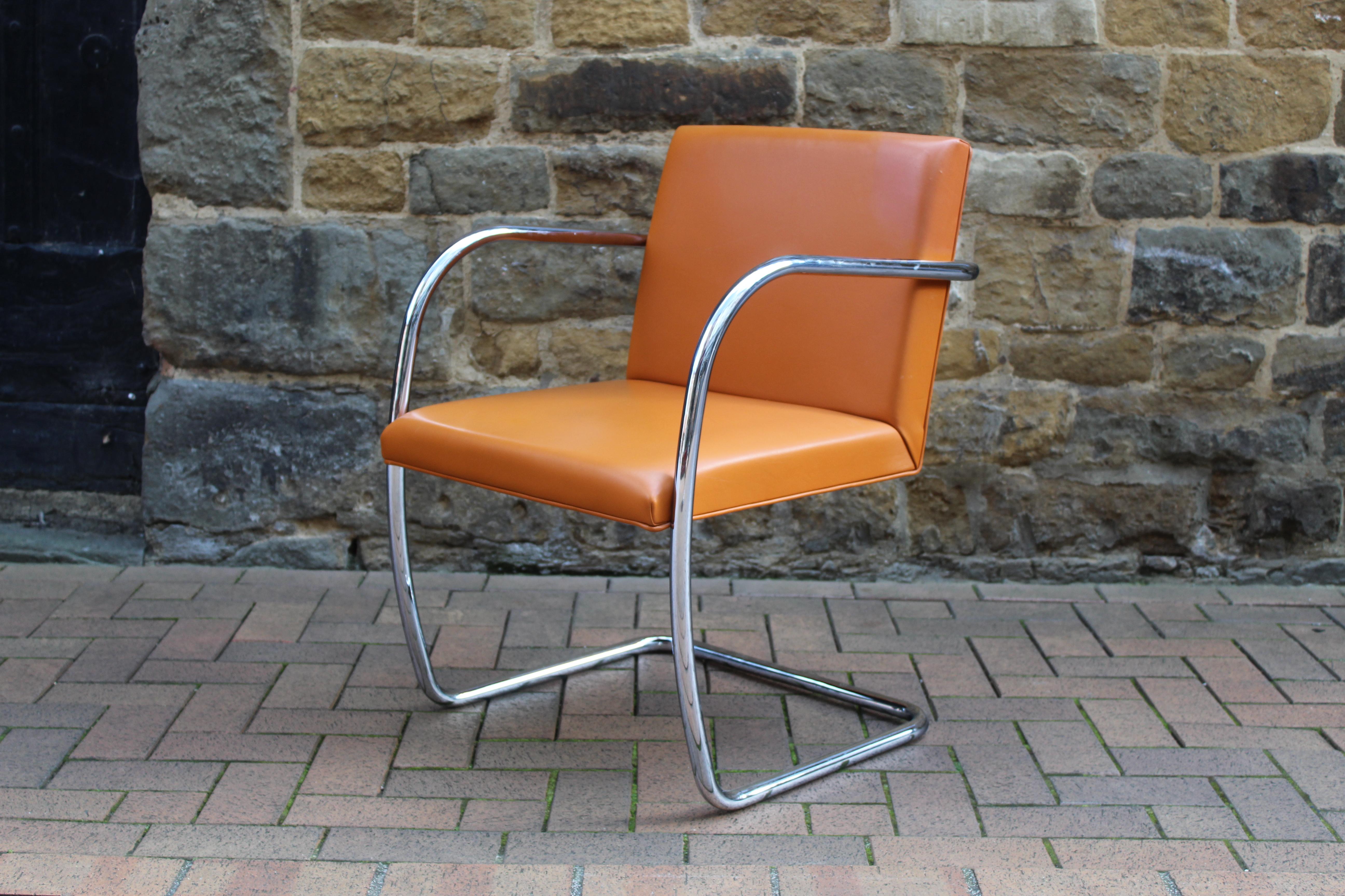 Ludwig Mies van der Rohe for Knoll International, a Model 245 ATC 'Brno' armchair with a chrome-plated cantilever frame with the Knoll logo embossed into it and upholstered in Spinneybeck leather Copenhagen 2203 'orange'.

  