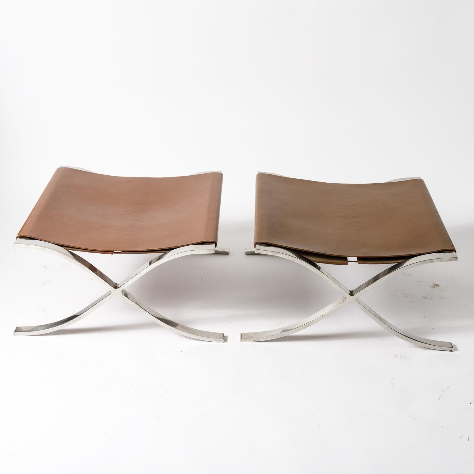 A pair of early Mies Van Der Rohe Sling Ottomans.
Original leather slings and lacing
Polished Stainless Steel Frames
Ottomans are slightly different in color
Knoll Labels