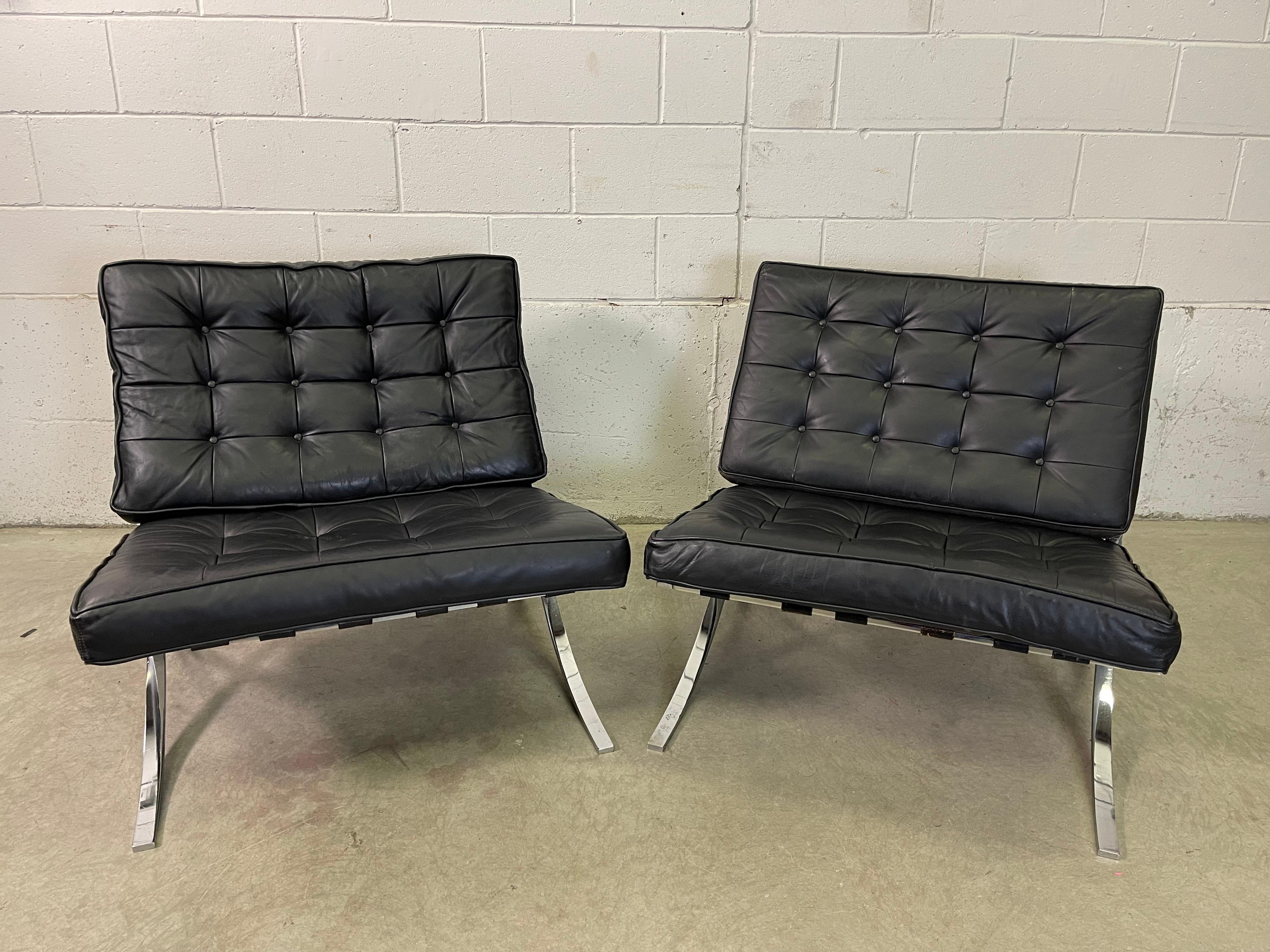 Vintage 1970s Barcelona style lounge chairs designed by Ludwig Mies van der Rohe. These chairs were made in Argentina. The leather seating and the frames are in very good used condition. The straps are all good and tight and the leather has minor