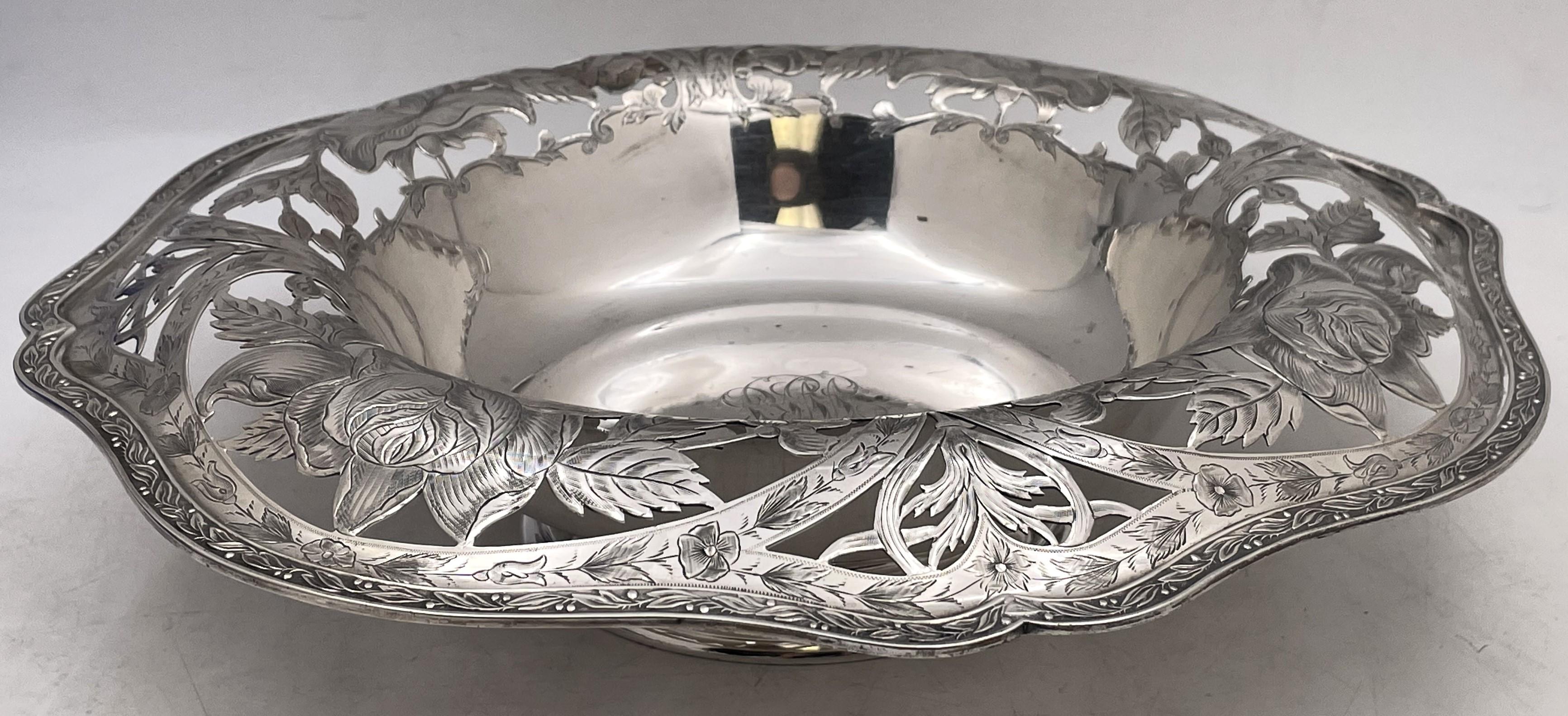 LudwiRedlich sterling silver centerpiece bowl from the early 1890s with a pierced rim adorned with floral motifs and in Art Nouveau style. It measures 12 7/8'' in diameter (inner diameter 7 7/8'') by 3 1/4'' in height, weighs 26 troy ounces, and