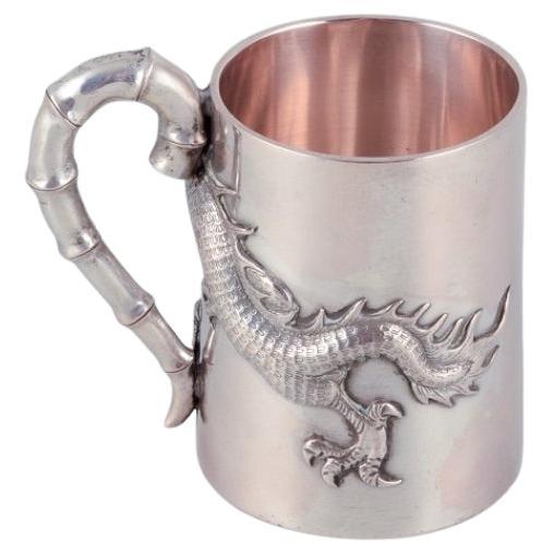 Luen-Wo, Shanghai. Silver cup with handle. Relief dragon motif. 1930s For Sale