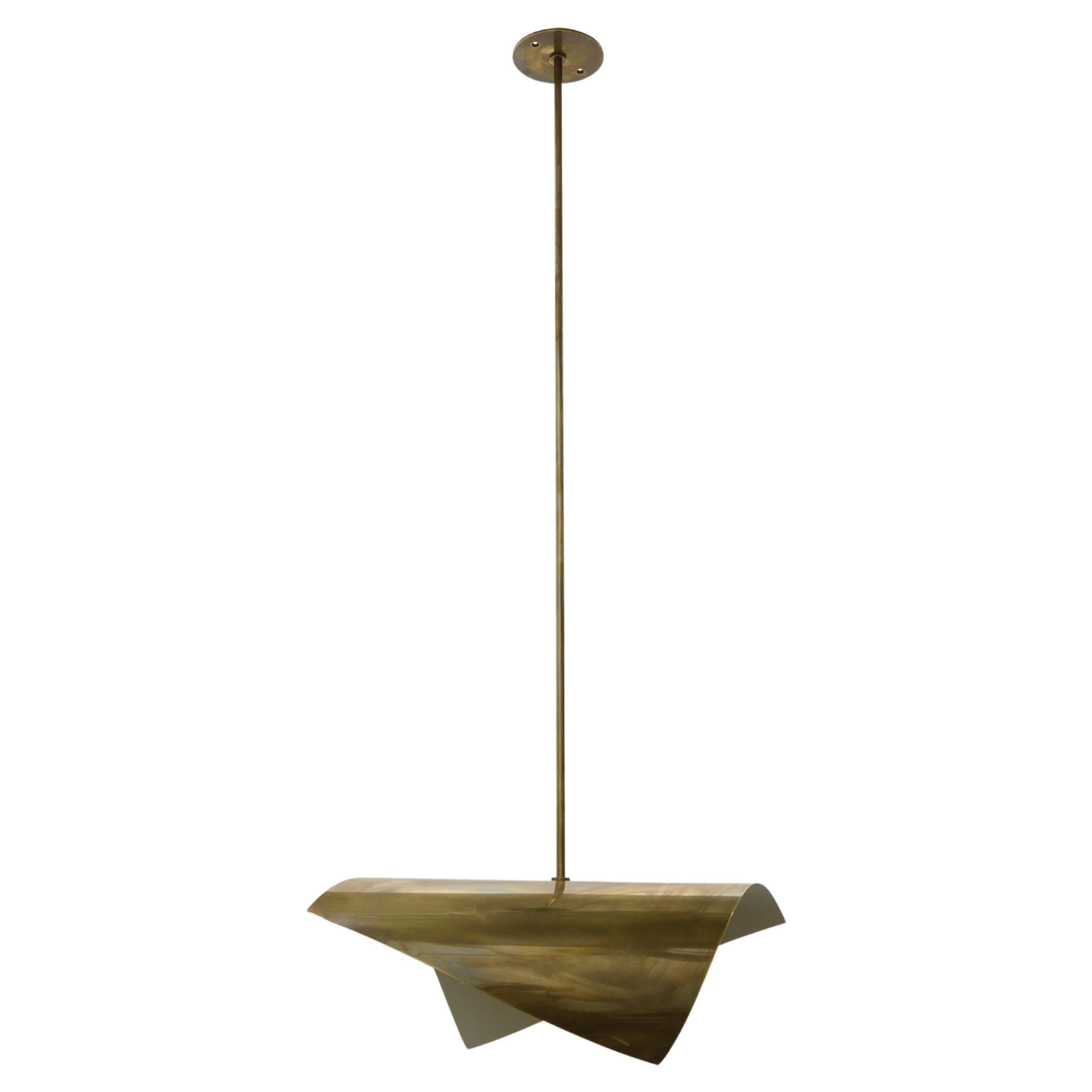 Elegant LUfold pendant inspired by classical mid century Italian design. Made in solid aged brass. Featuring a graceful contoured curved design, this pendant is wired with 1-E12 candelabra based socket and can also be wired for use anywhere in the