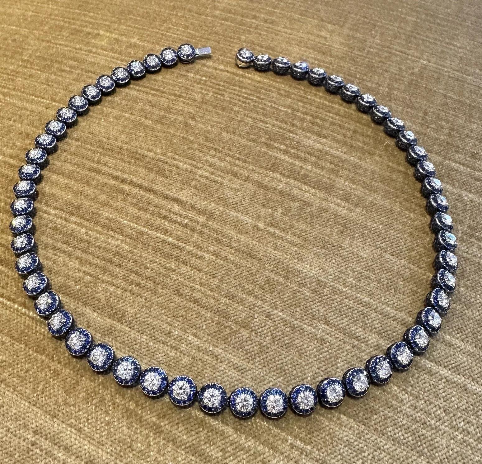 Lugano Diamond and Sapphire Choker Necklace in 18k White Gold

Diamond and Sapphire Necklace by Lugano features 56 Semicircular Links with Pave set Natural Blue Sapphires and one Round Brilliant Diamond on top, all set in 18k White Gold. The