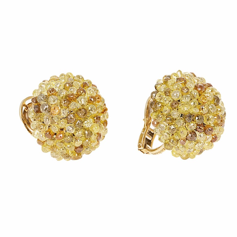 Lugano, fancy colored briolette diamond lever back earrings with over 30 carats in diamonds. The earrings feature multi-colored diamonds set in 18 karat yellow gold. There are over 100 diamonds ranging in color from yellow, orange, green and brown.