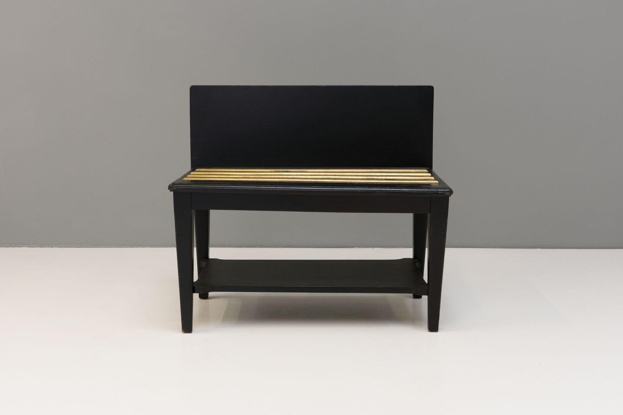 Black painted luggage stand with brass rails. Circa 1900
H 62cm x W 70cm x D 40cm