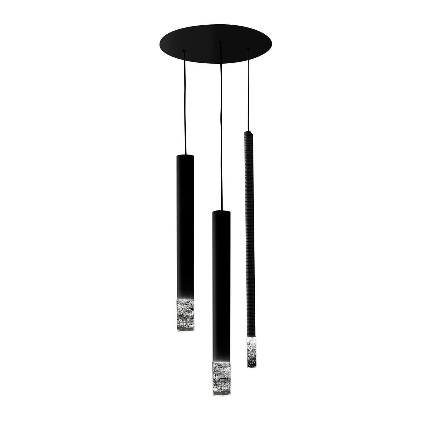 The Luh pendant lamp is a contemporary lighting solution that couples function with design harmony. Suspended at staggered heights from a black round metal ceiling plate, two Ubo and one Stillo Rings pendants form a stunning composition. All three