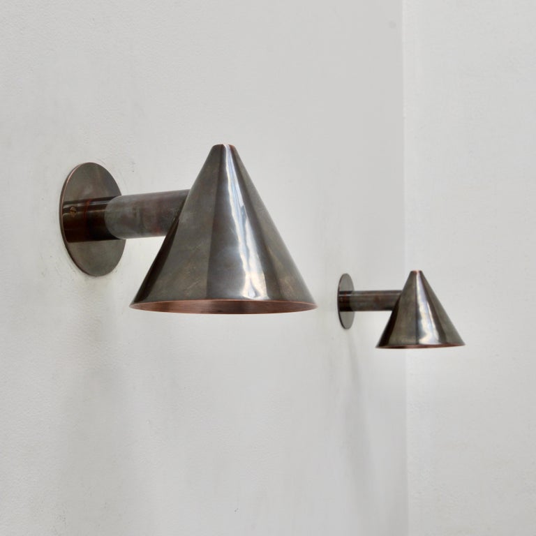 Part of our Lumfardo Luminaries contemporary collection, this LUhans patinated un-lacquered copper indoor outdoor sconce is inspired by Scandinavian mid-century design. Wired with a single E26 socket for use in the US. Can be wired for use anywhere