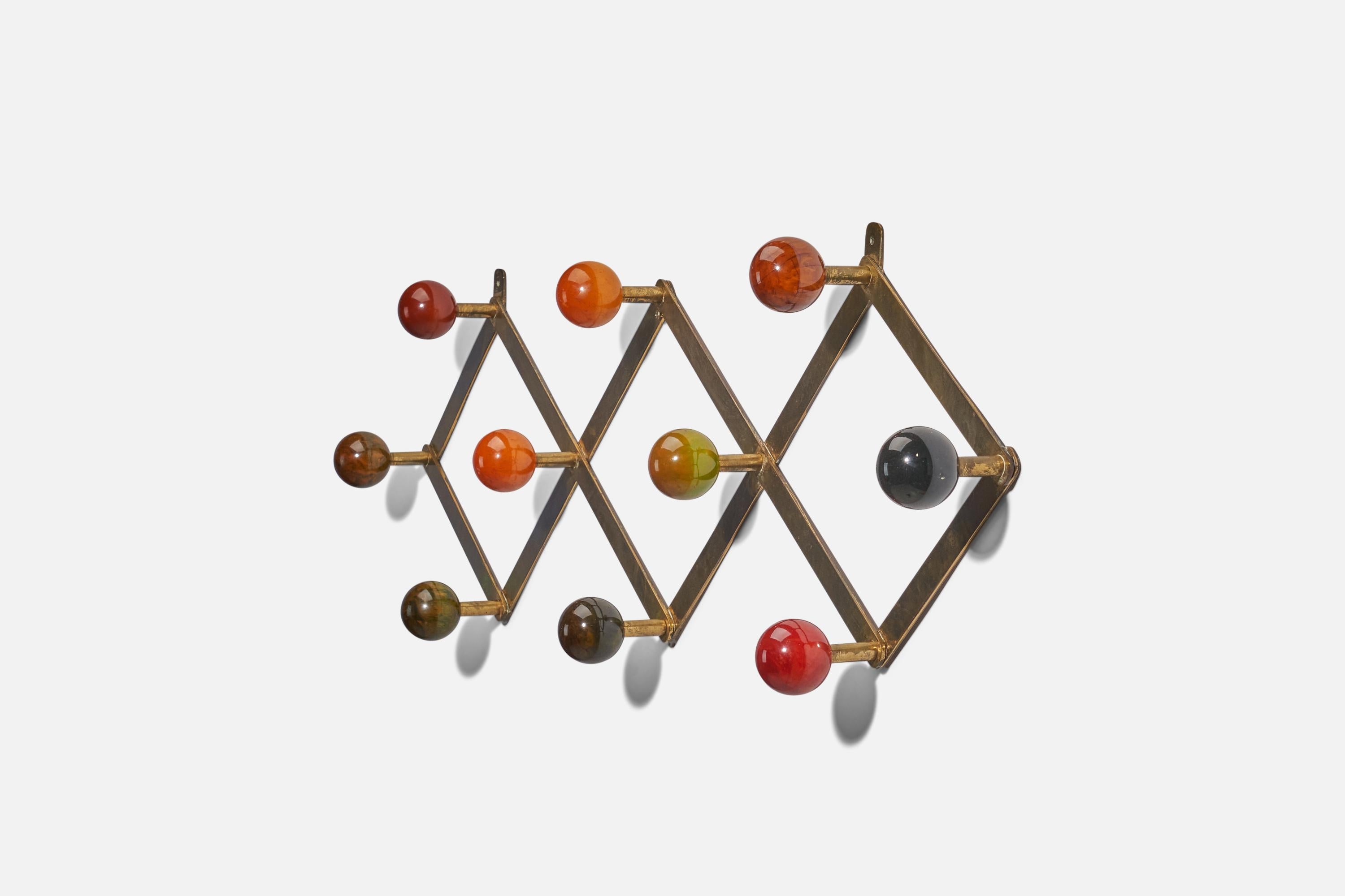 A brass and resin coat rack; design and production attributed to Luigi Caccia Dominioni, Italy, 1950s.