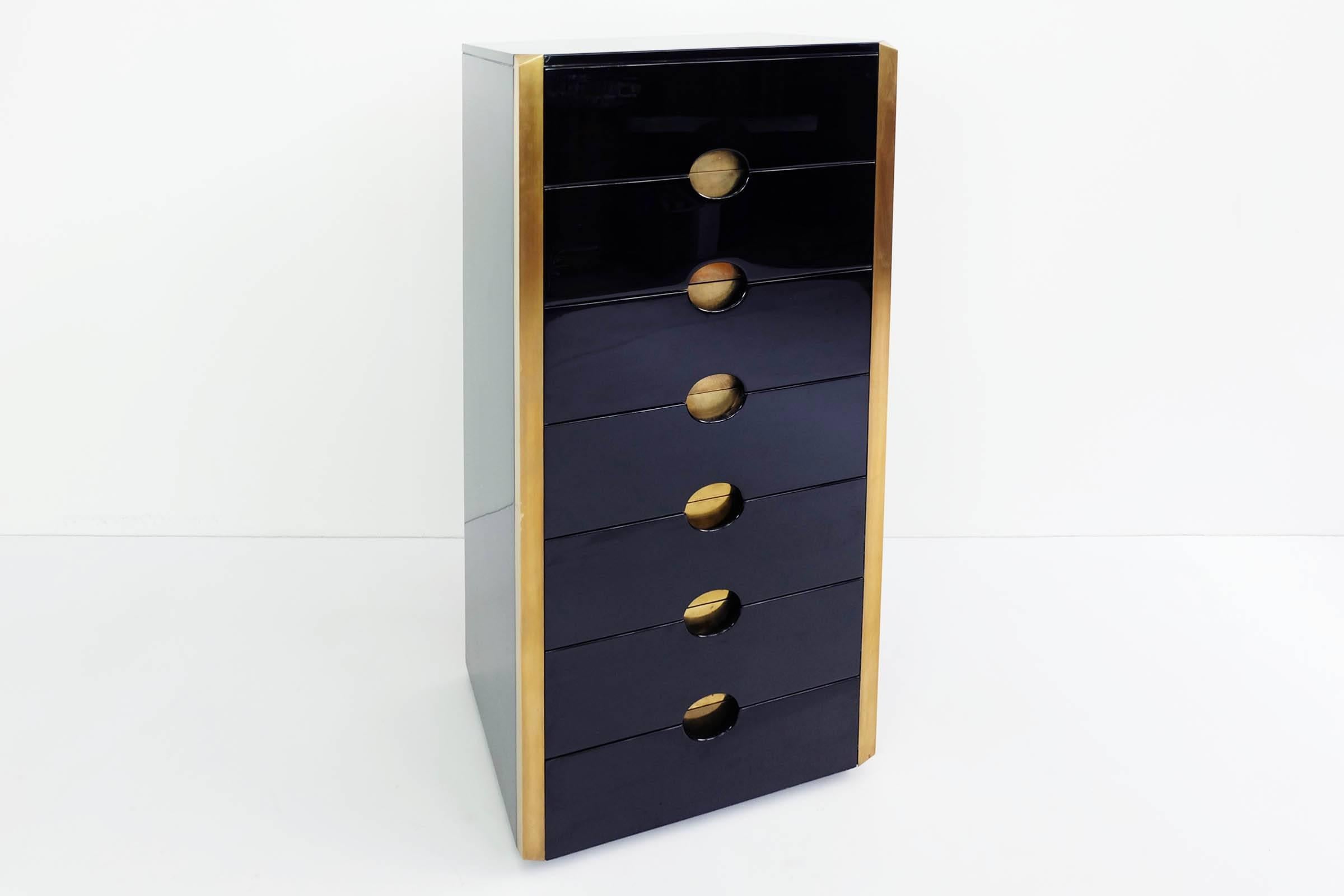 Very stylish and rare chest of drawers in black hi quality lacquered wood in perfect conditions.
The handle brass details is in massive brass plate.
 