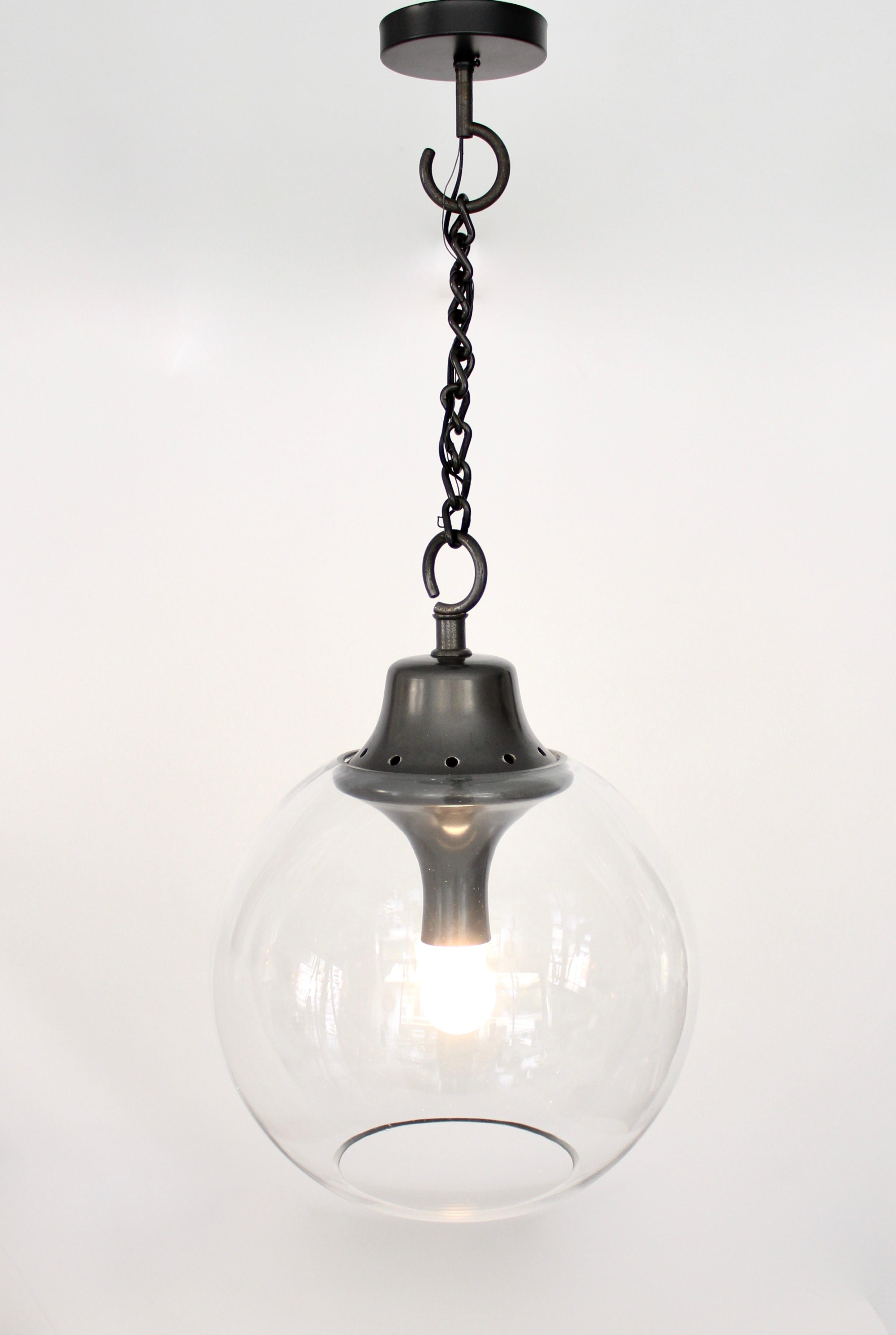 Luigi Caccia Dominioni Boccia LC10 Pendant Chandelier for Italian Maker Azucena
The design of this lamp is incredibly simple. It is an ode to light, a kind of archetypical suspended ball. The lamp features a varnished iron chain, hook, and a