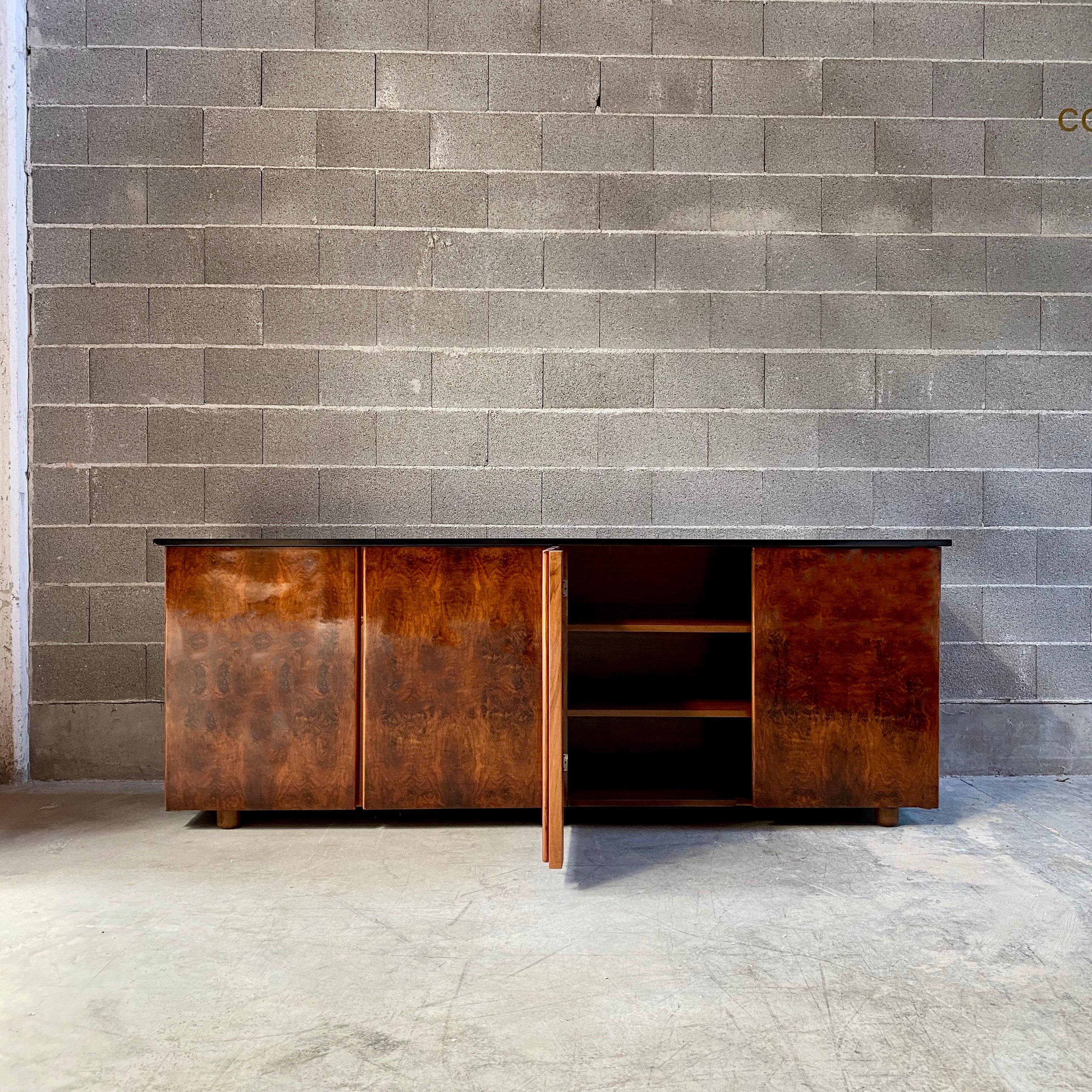 Luigi Caccia Dominioni Burl sideboard for Azucena, 1978

Combining a novel technical solution, a strong chromatic statement and rounded contours, Caccia Dominioni set a new standard for modern design in its clear insistence on the compactness of